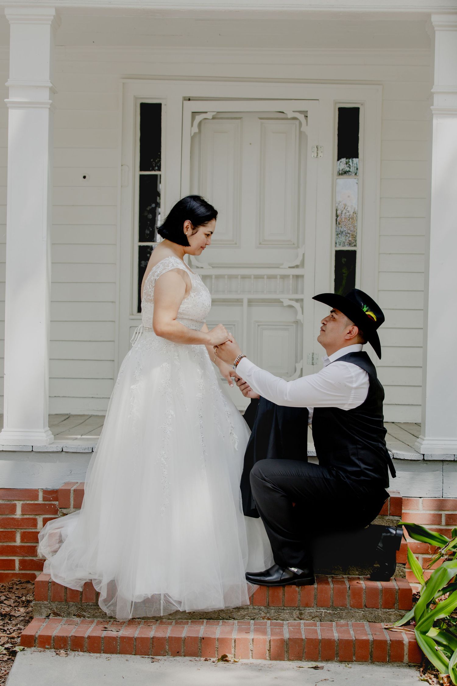 A sweet proposal scene unfolds on a classic Southern porch with white columns.