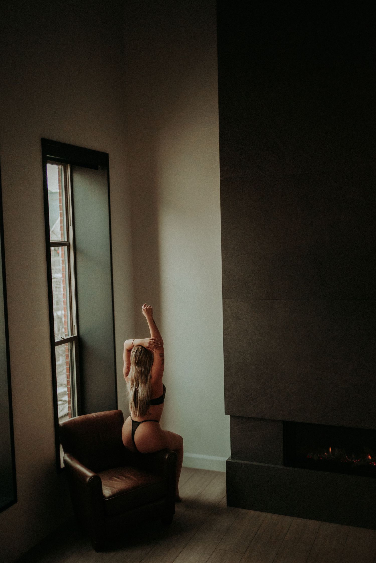A series of moody interior photos showing a silhouette against a window in a minimalist room with dark shadows.