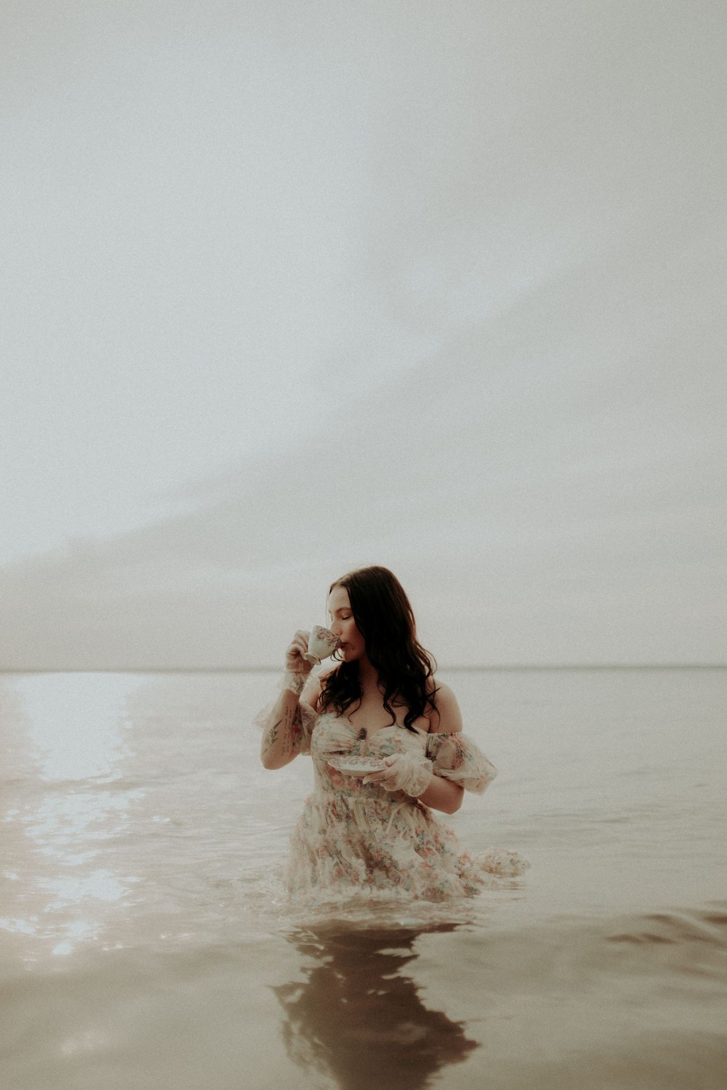 Atmospheric water photoshoot featuring gentle movements and vintage styling.