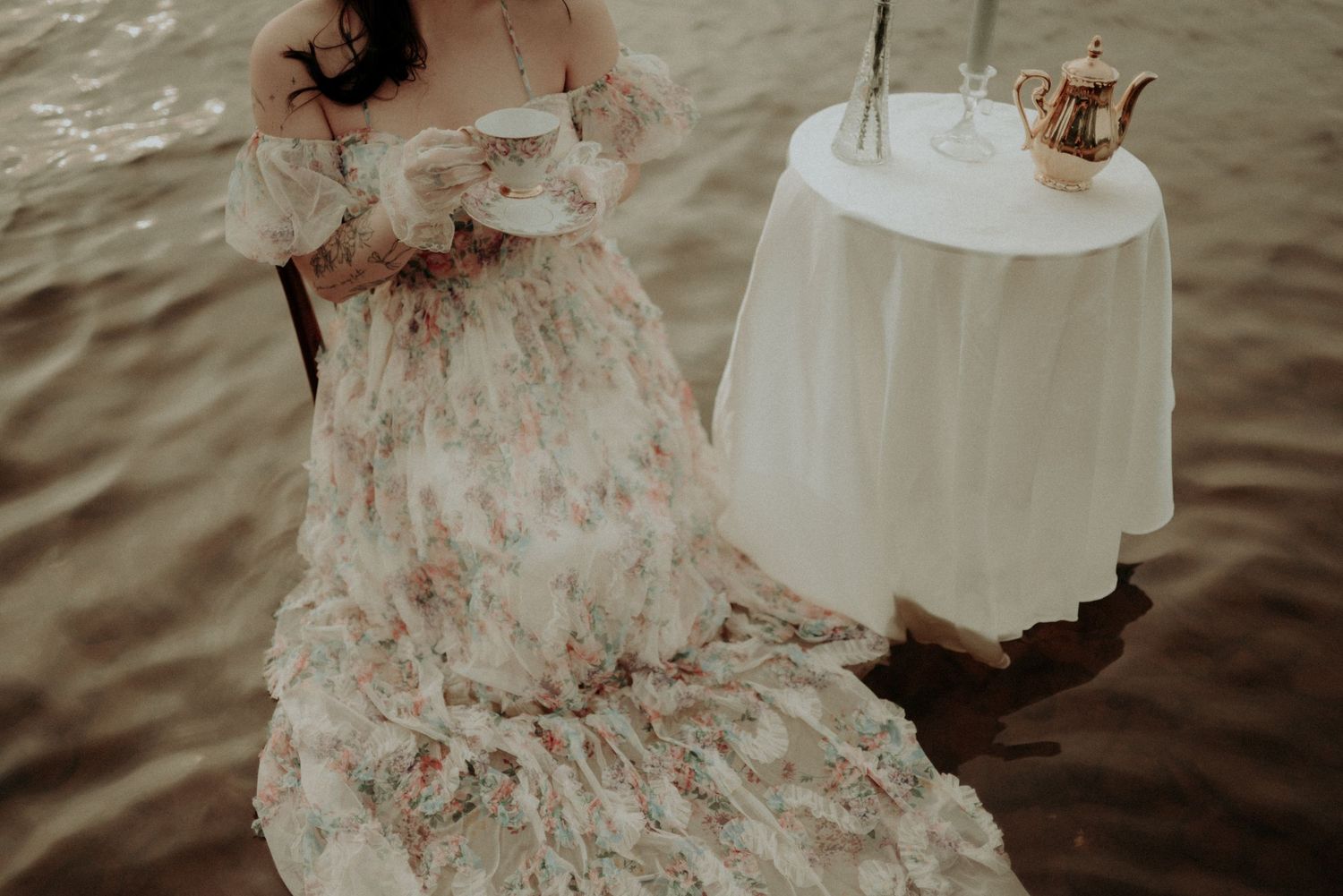 Artistic water photography with furniture and feminine styling in muted tones.