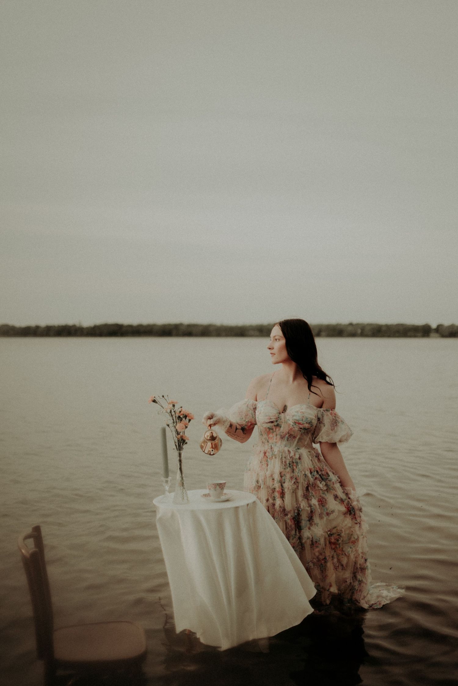 Dramatic water photoshoot featuring vintage furniture and romantic styling.