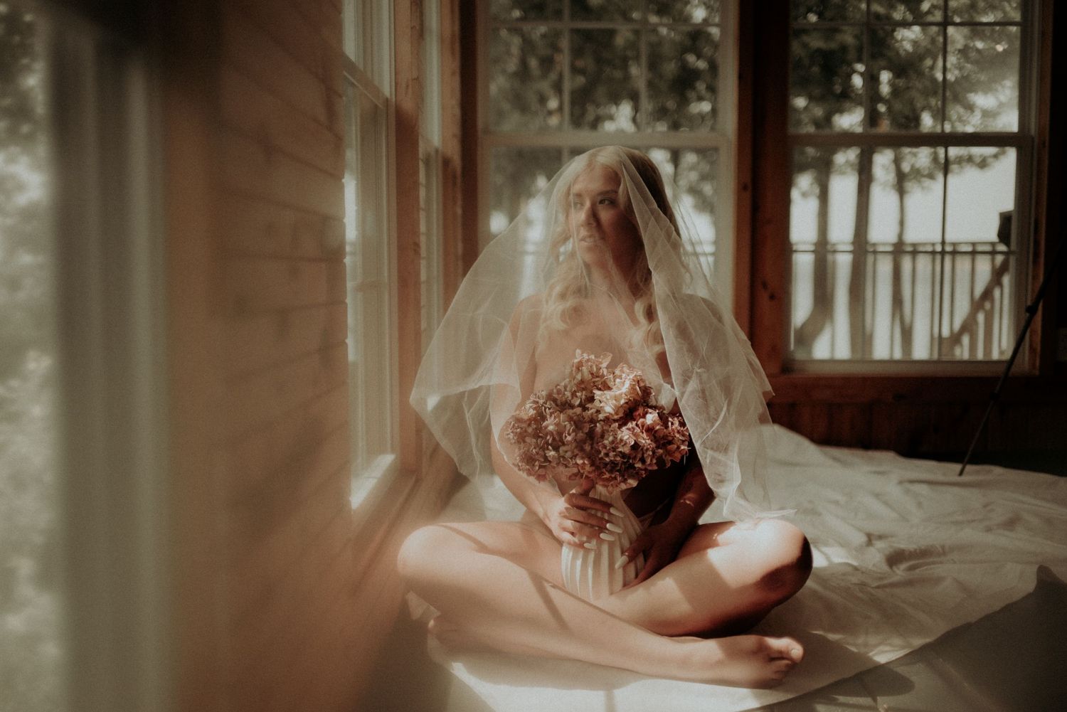 Intimate portrait series with soft window lighting and vintage wood paneling.