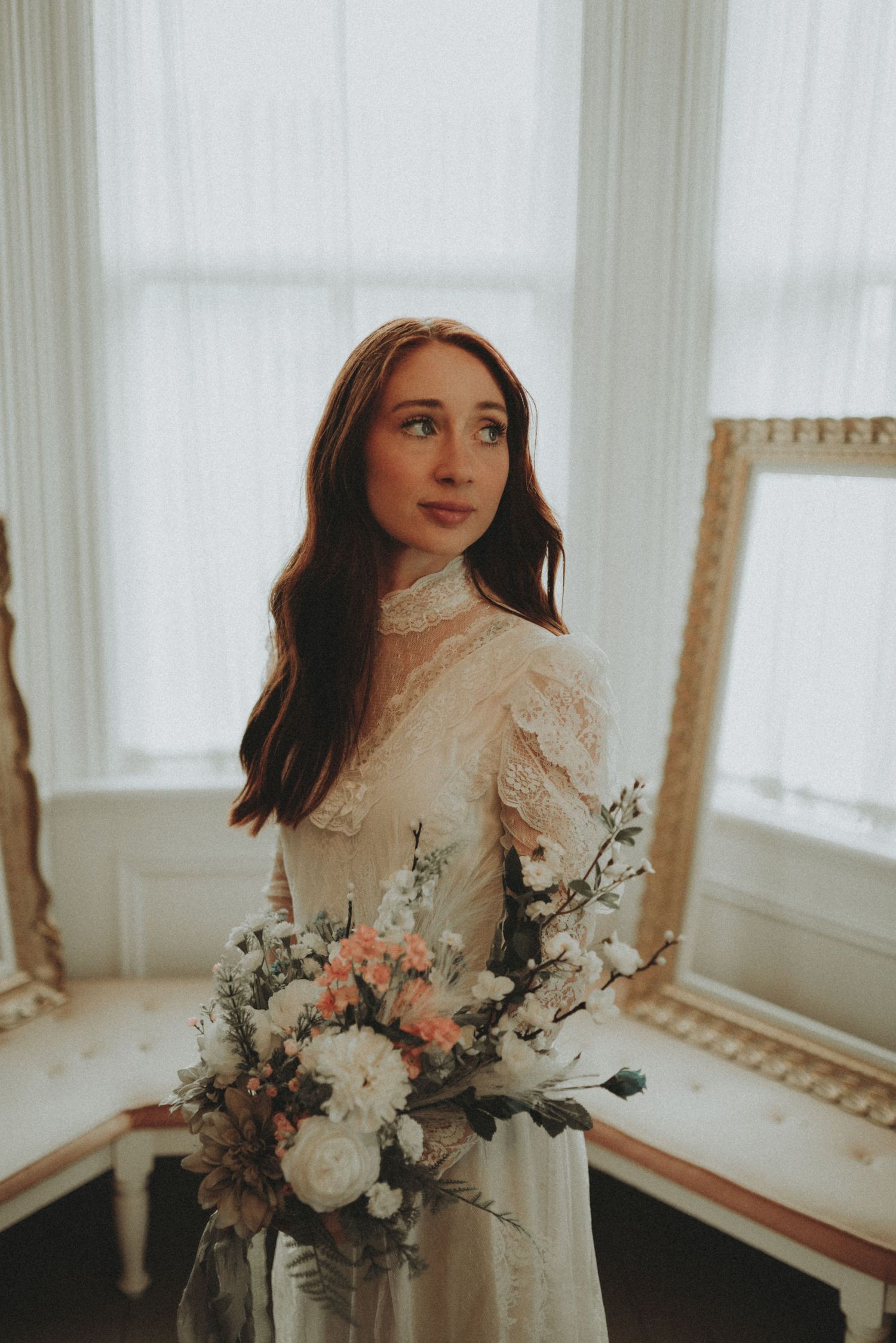 Elegant bridal portrait series featuring lace details and soft pastel bouquet in natural window light.