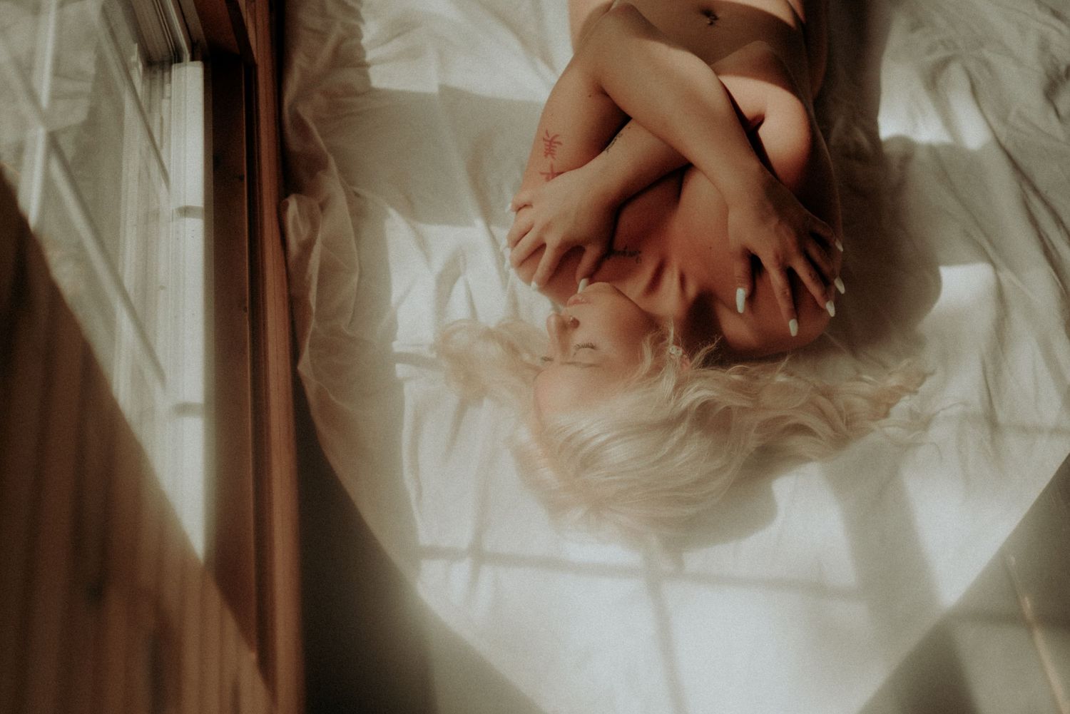 Delicate movement study with sheer fabrics in natural window light.