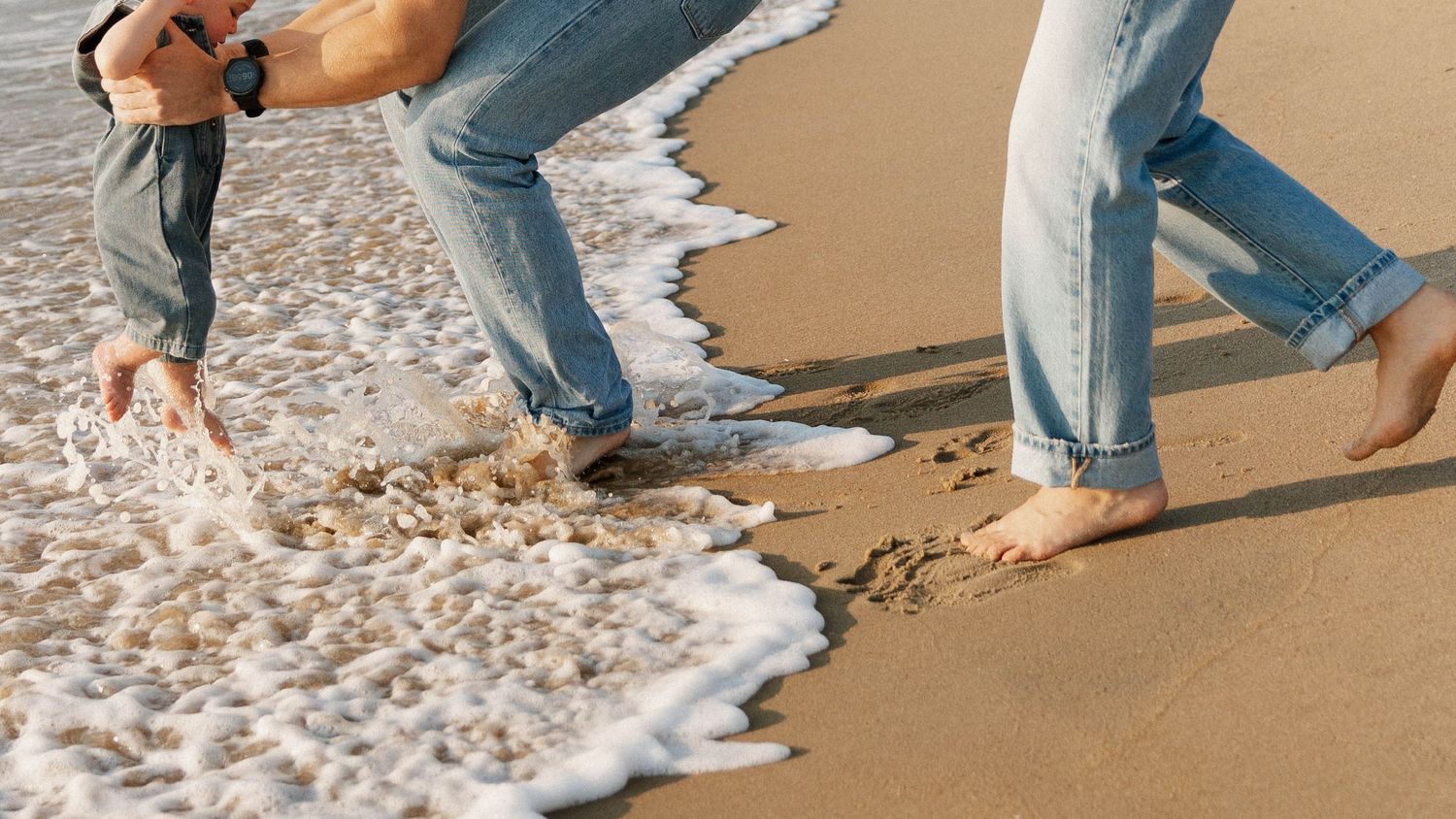 Virginia Beach family photographer photographs family at sunrise in Virginia Beach.