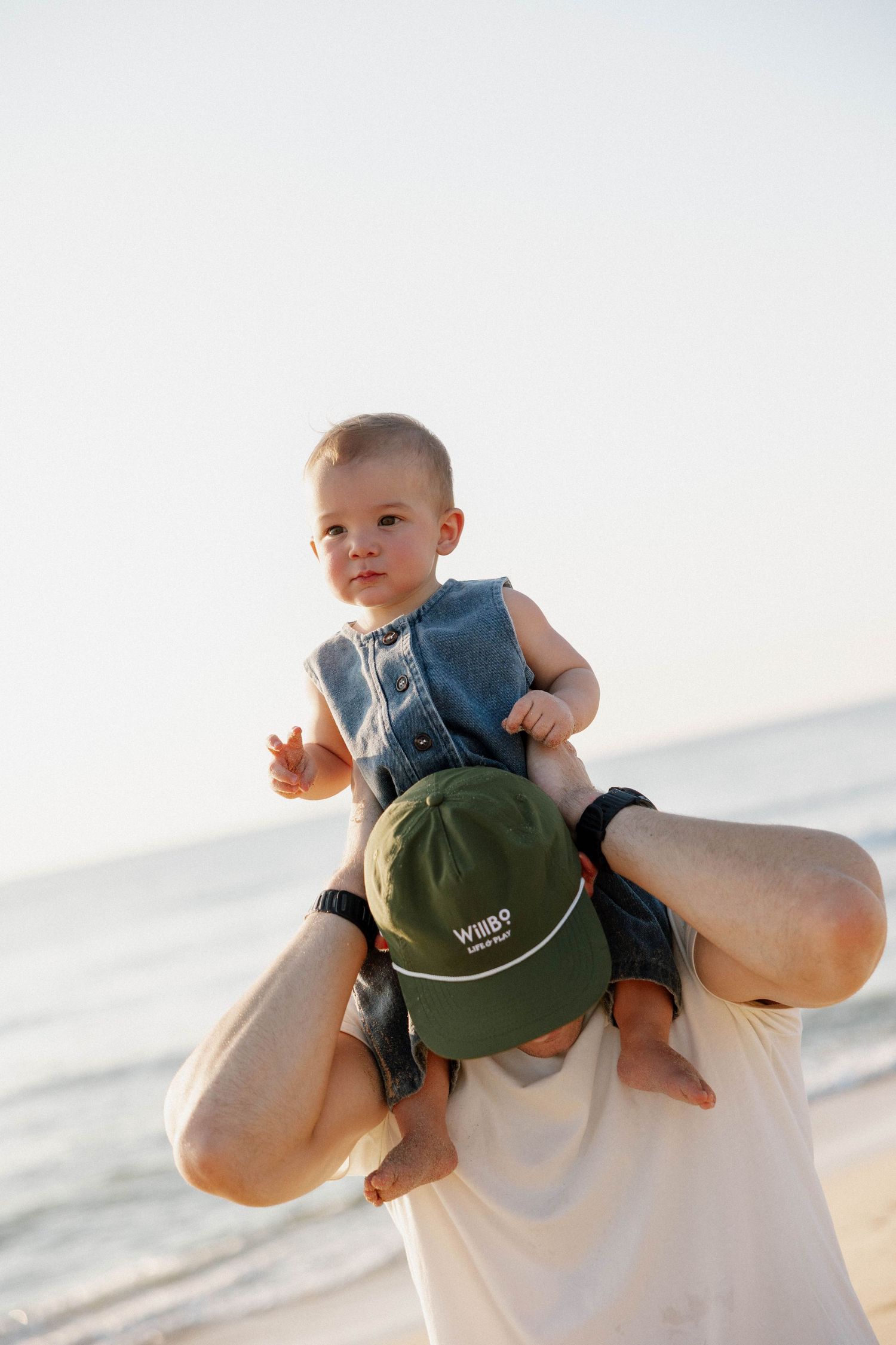 Virginia Beach family photographer photographs family at sunrise in Virginia Beach.