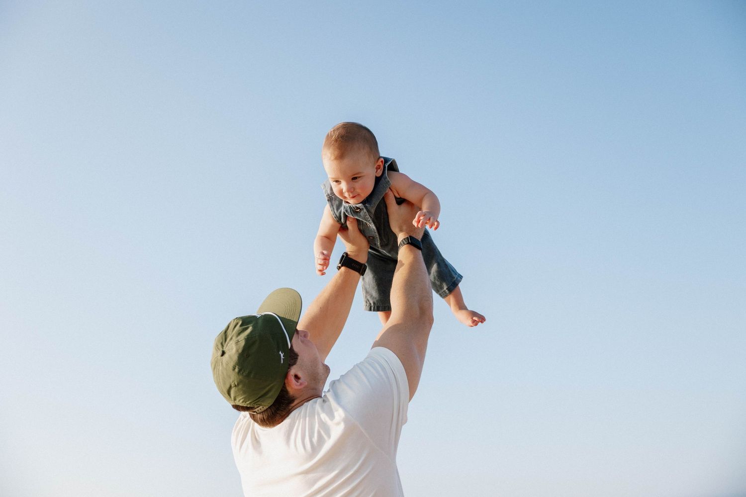 Virginia Beach family photographer photographs family at sunrise in Virginia Beach.