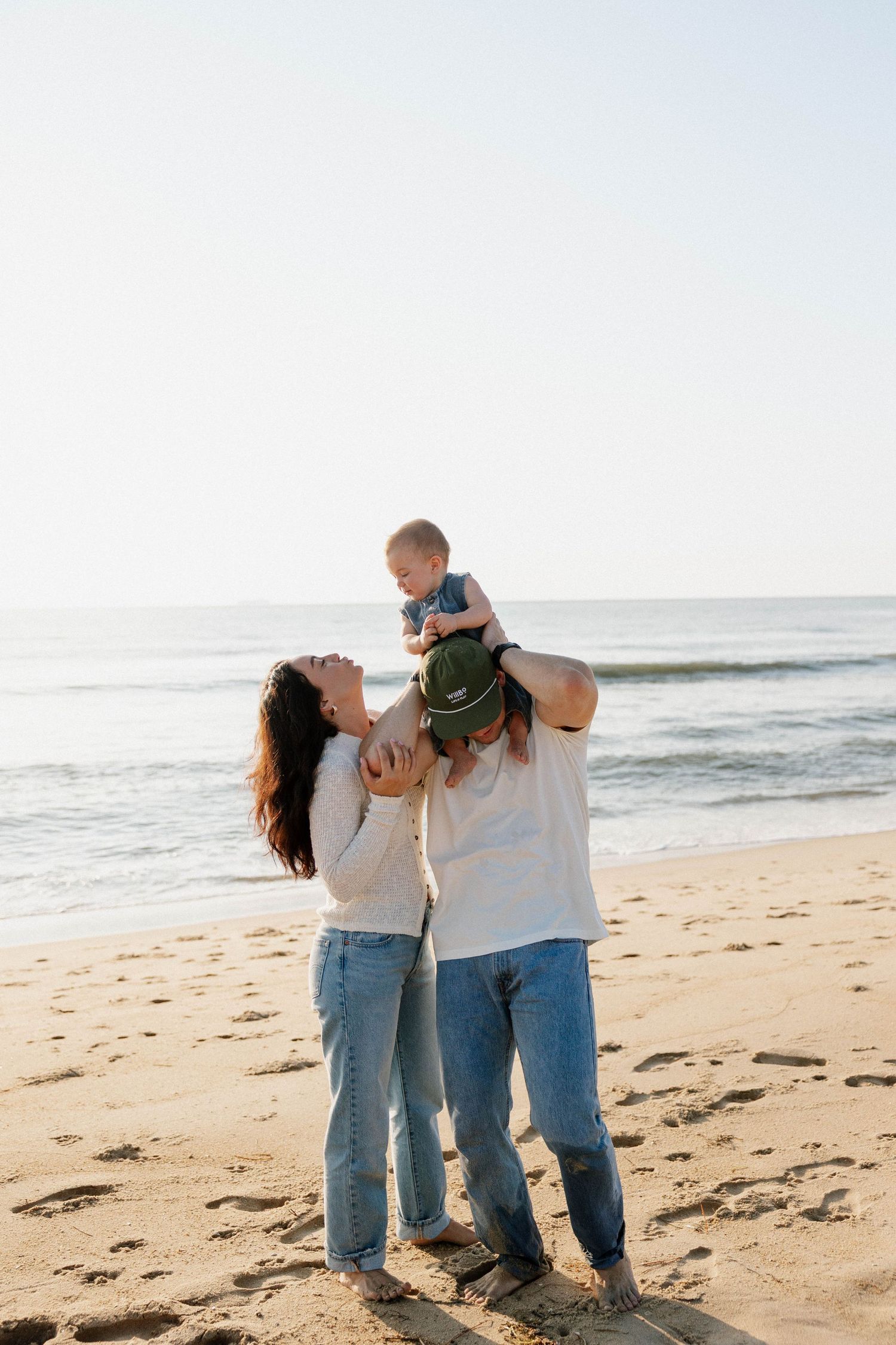 Virginia Beach family photographer photographs family at sunrise in Virginia Beach.