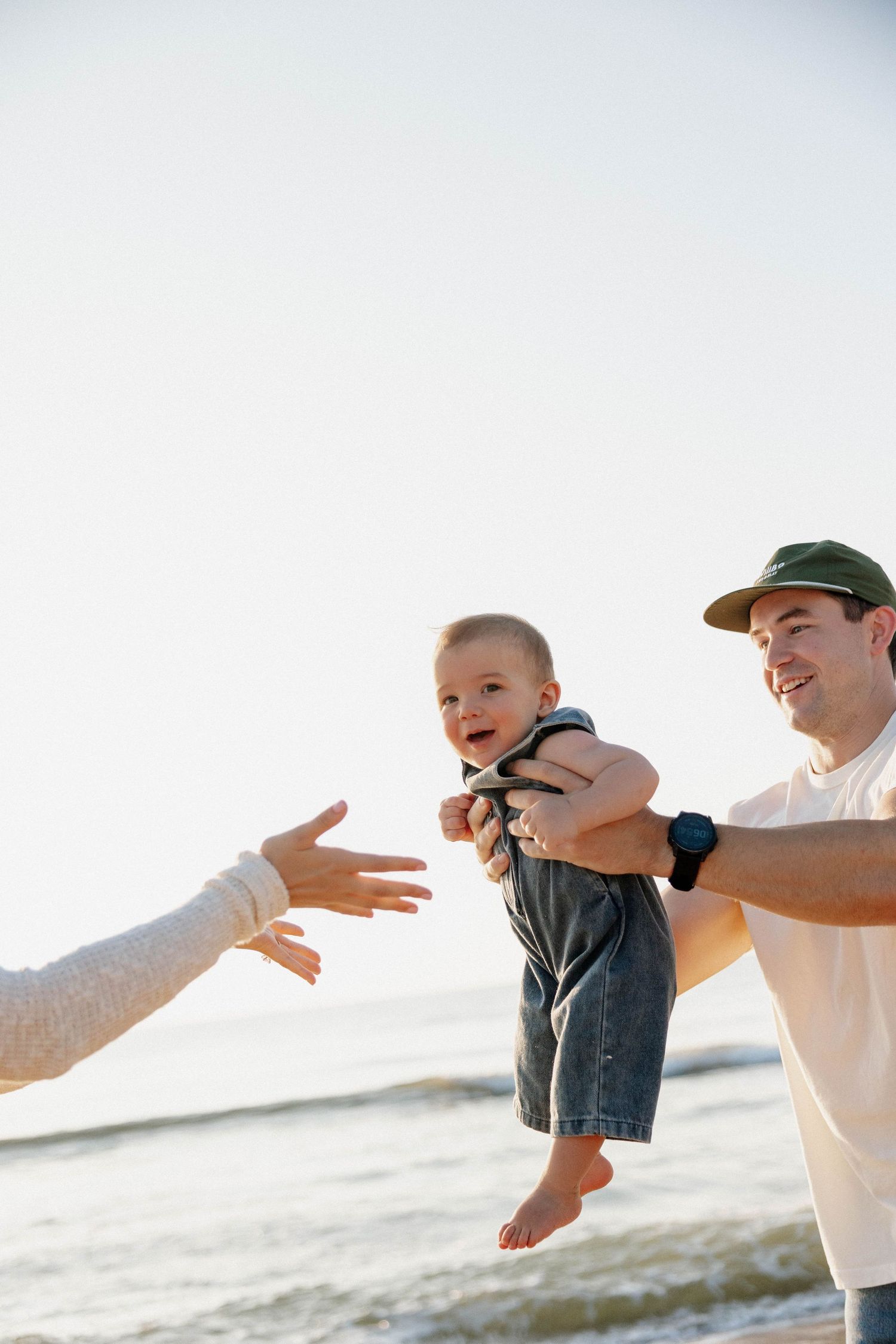 Virginia Beach family photographer photographs family at sunrise in Virginia Beach.
