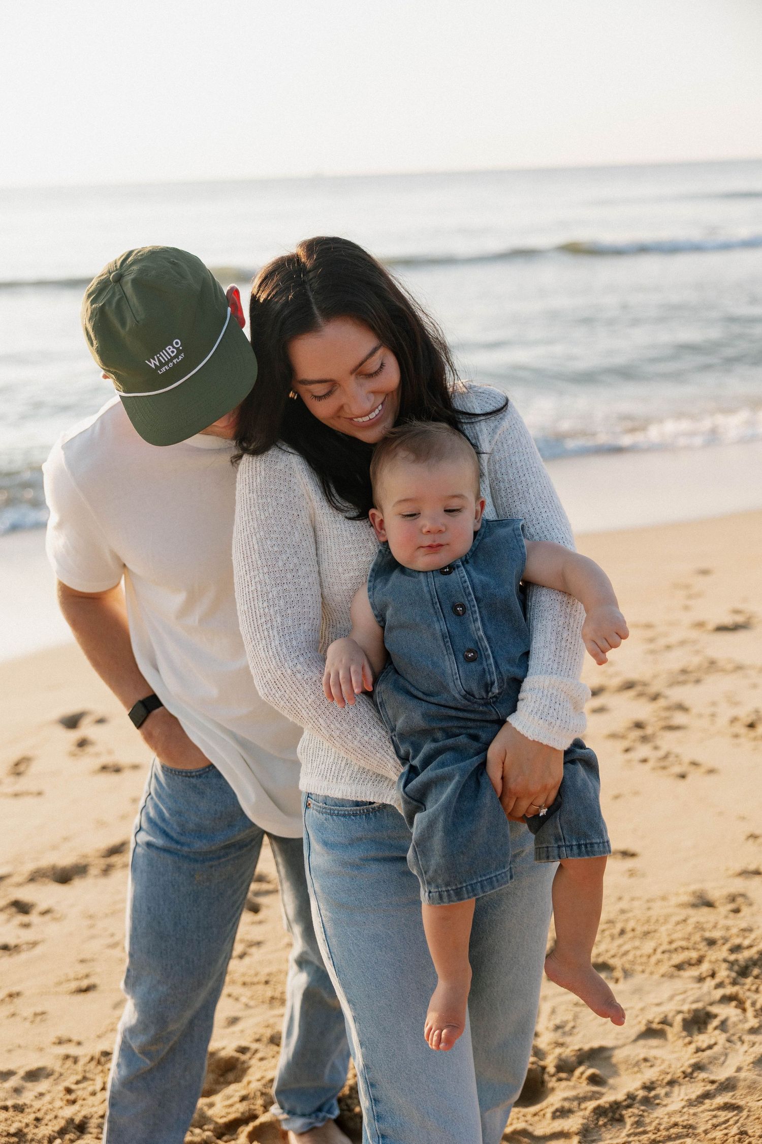 Virginia Beach family photographer photographs family at sunrise in Virginia Beach.