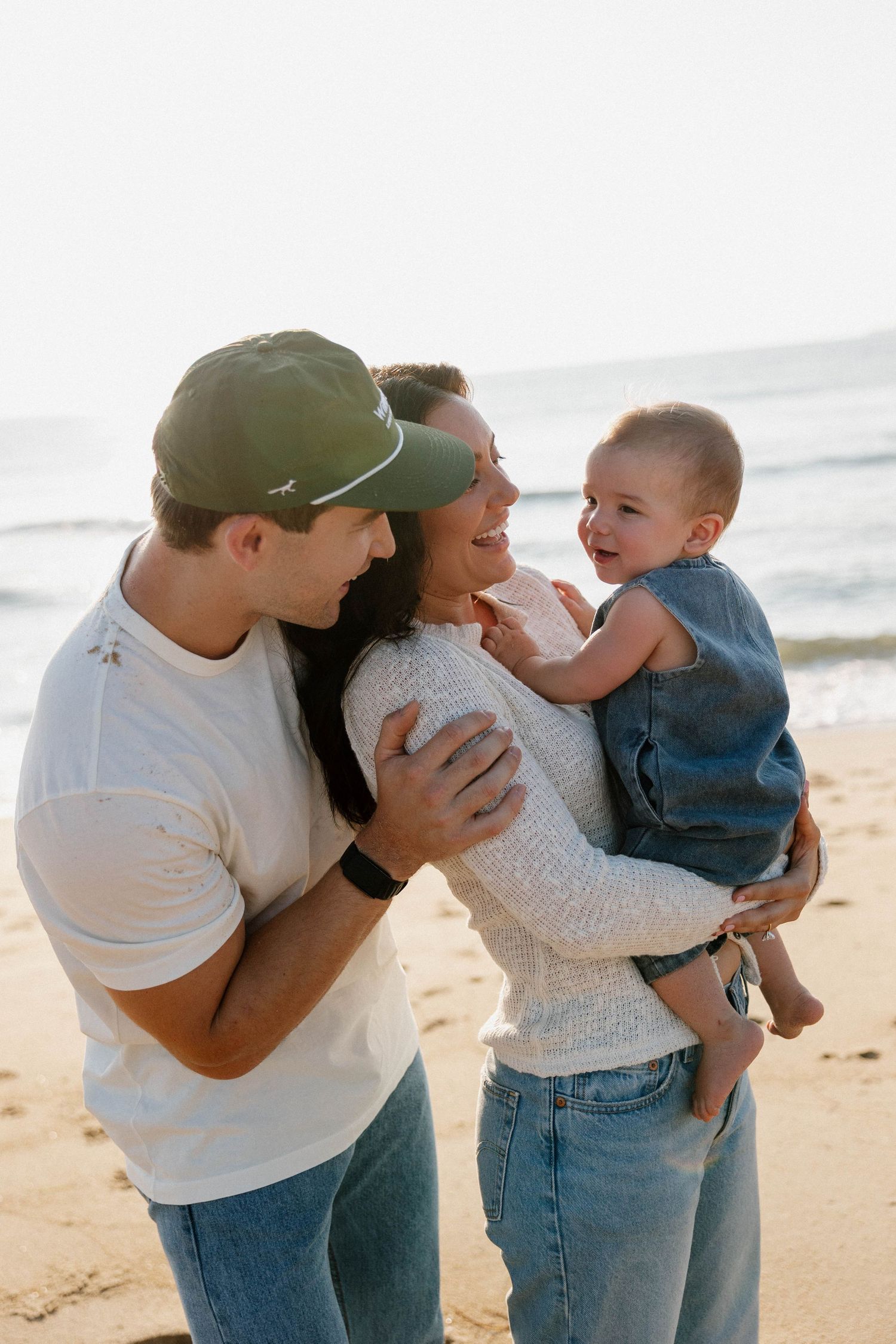 Virginia Beach family photographer photographs family at sunrise in Virginia Beach.