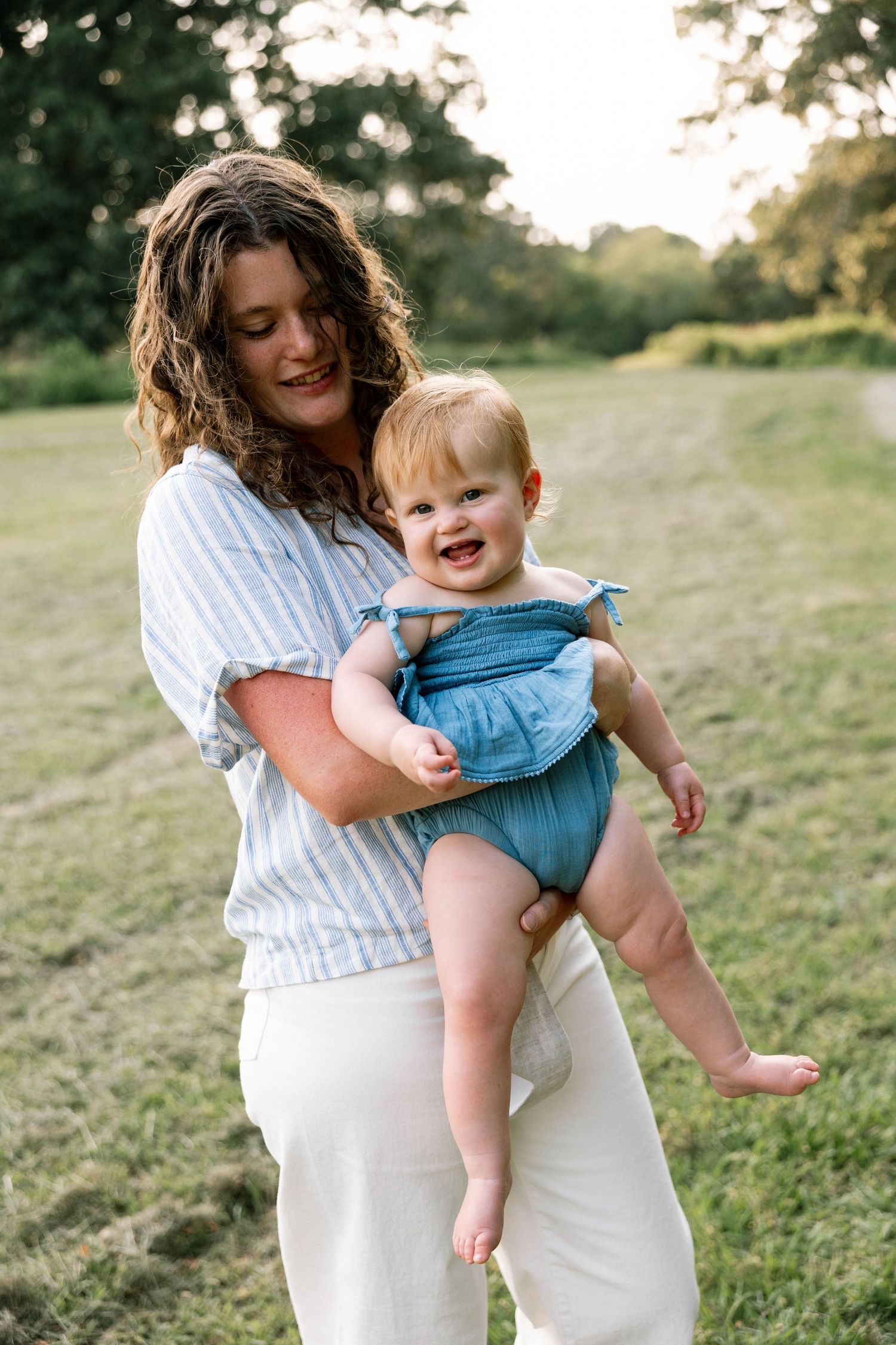 Virginia Beach Family Photographer photographs babies first birthday in beautiful field setting.