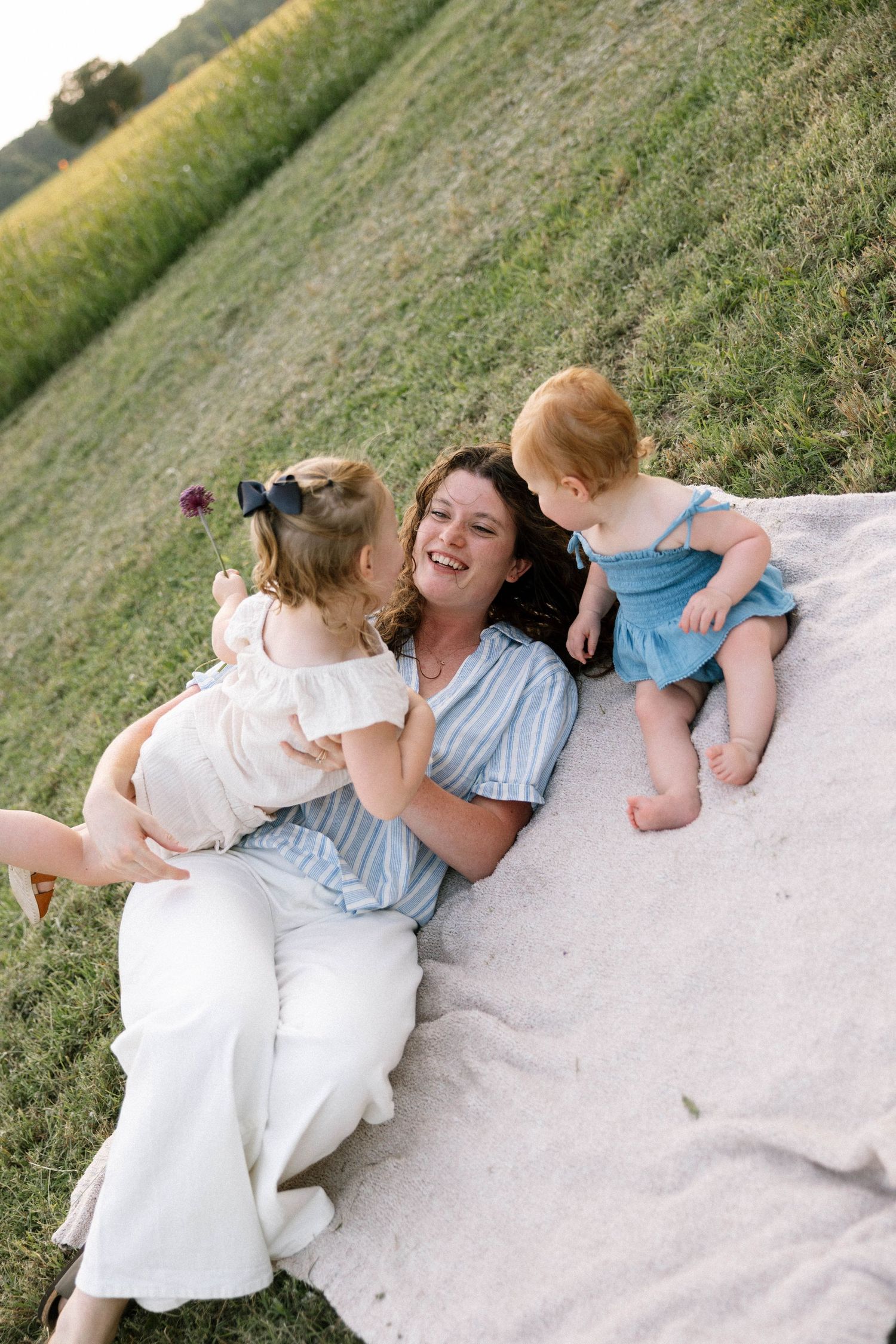 Virginia Beach Family Photographer photographs babies first birthday in beautiful field setting.