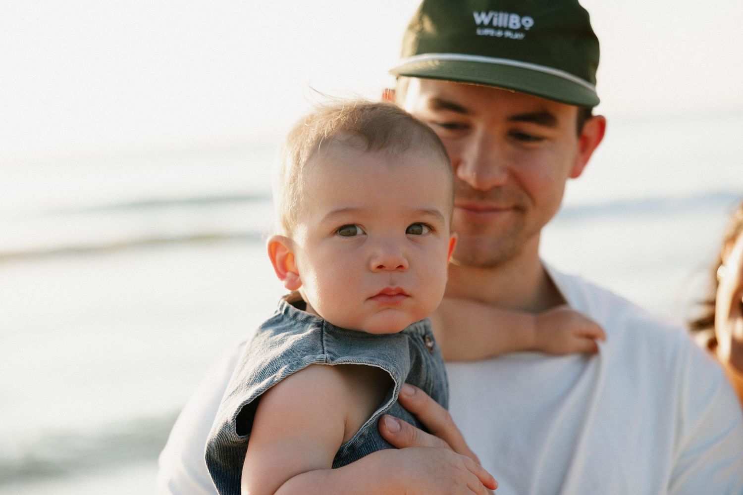 Virginia Beach family photographer photographs family at sunrise in Virginia Beach.