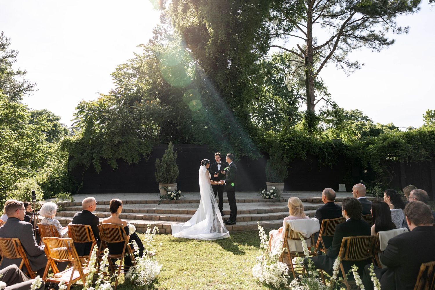 Virginia Beach Wedding Photographer captures candid moment of bride and groom at the alter. Virginia Wedding at The Pinner House
