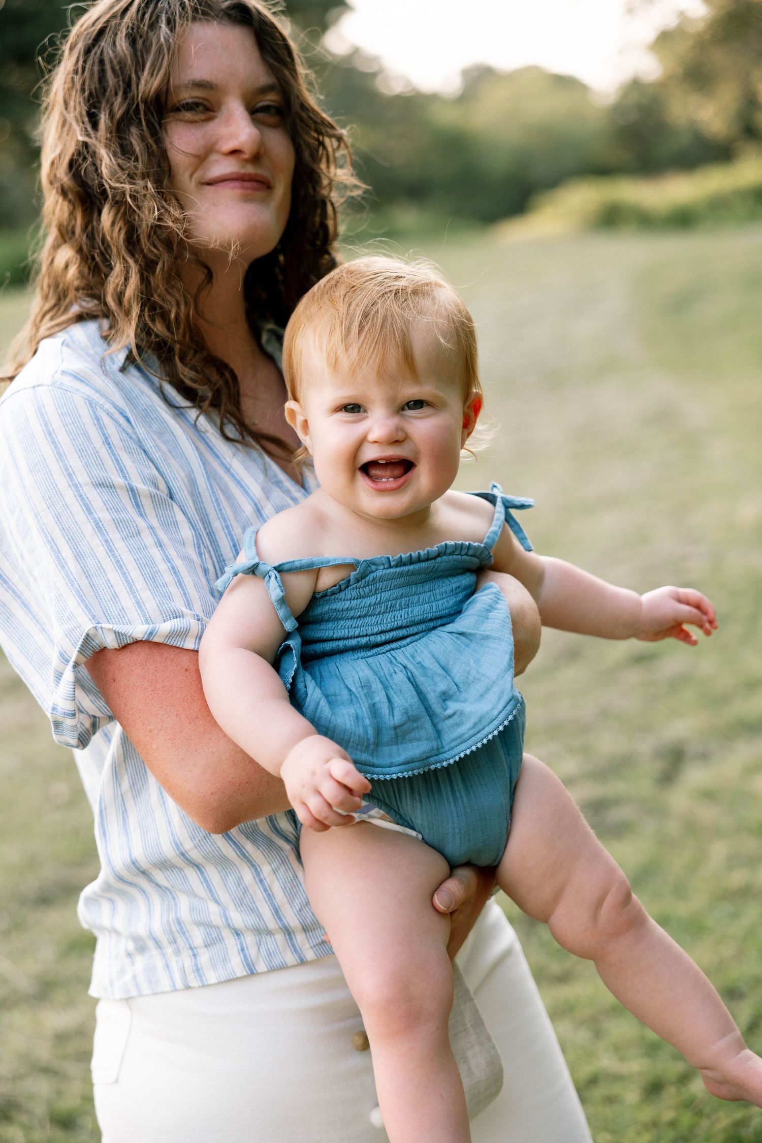 Virginia Beach Family Photographer photographs babies first birthday in beautiful field setting.