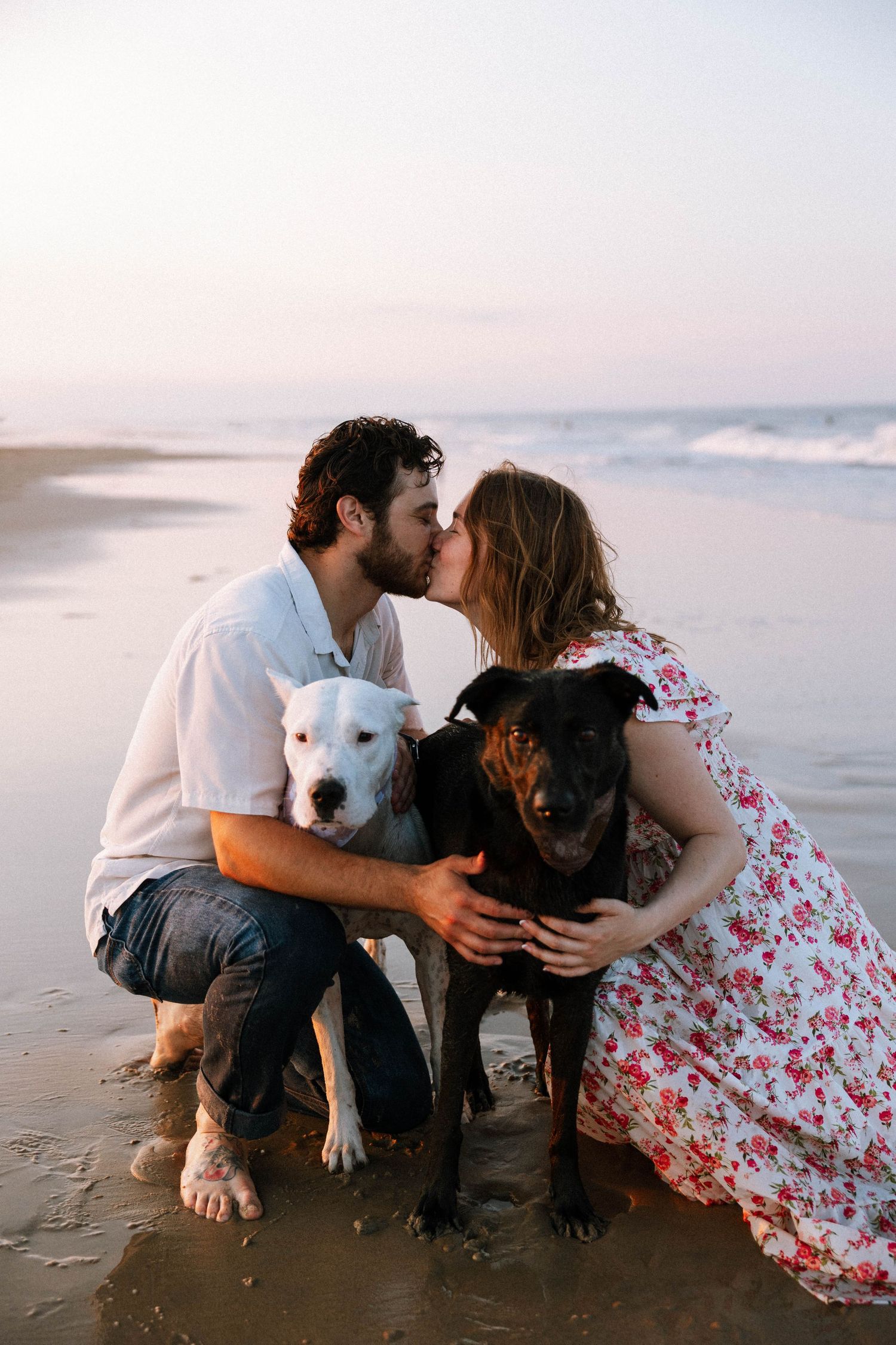 Virginia Beach wedding photographer photographs couples session with dogs.