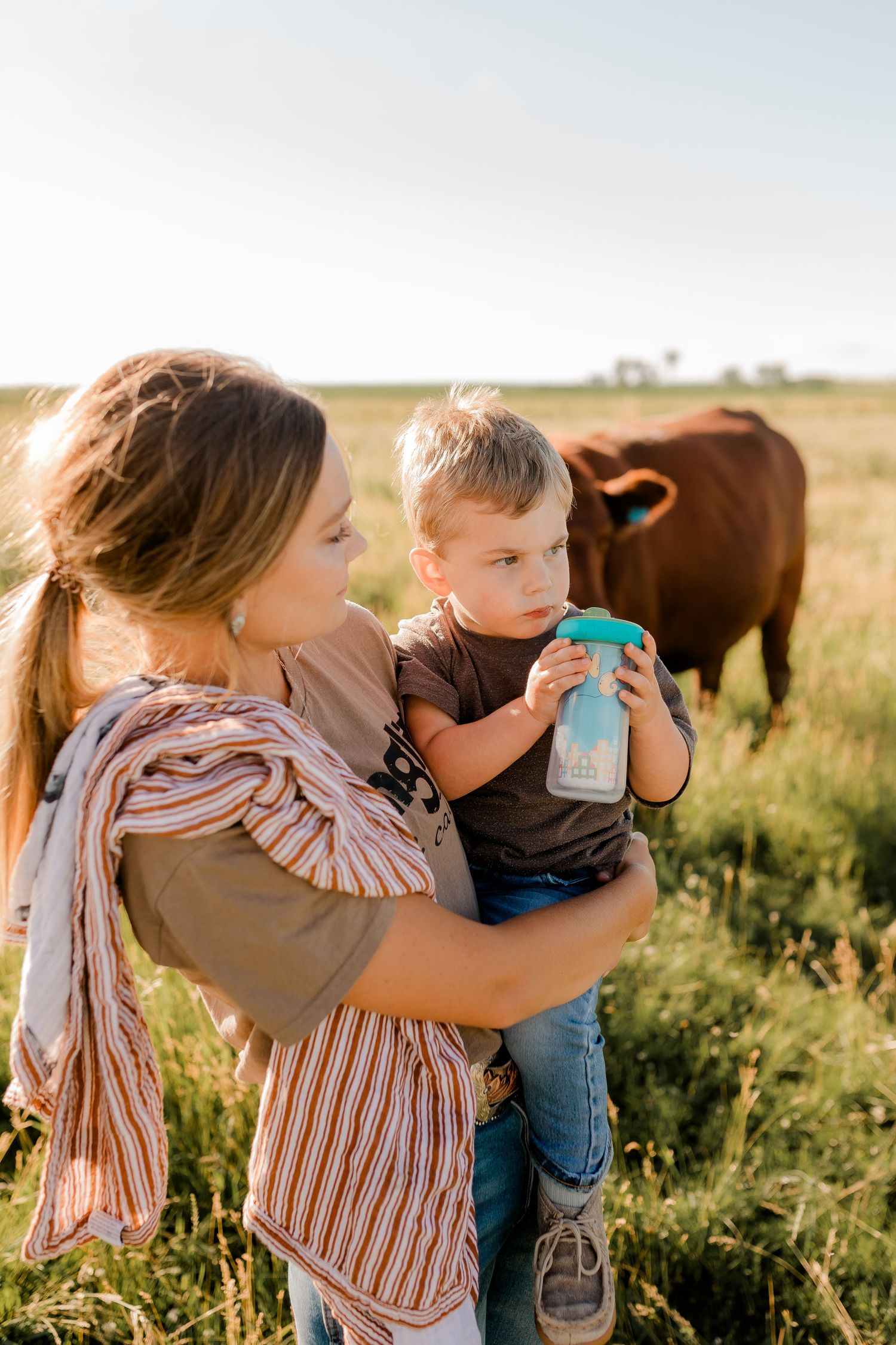 Family portrait on a working farm during lifestyle photo session in Clark County, South Dakota