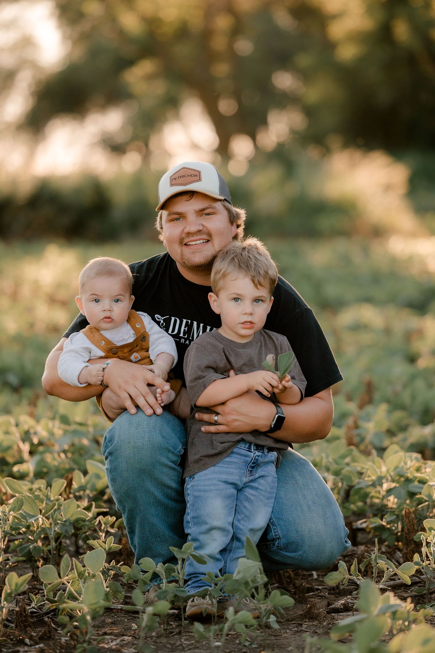 Family portrait on a working farm during lifestyle photo session in Clark County, South Dakota