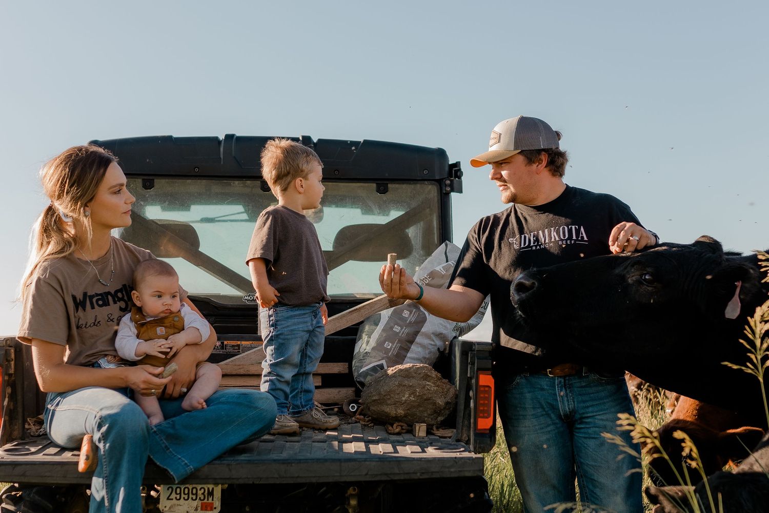 Family portrait on a working farm during lifestyle photo session in Clark County, South Dakota