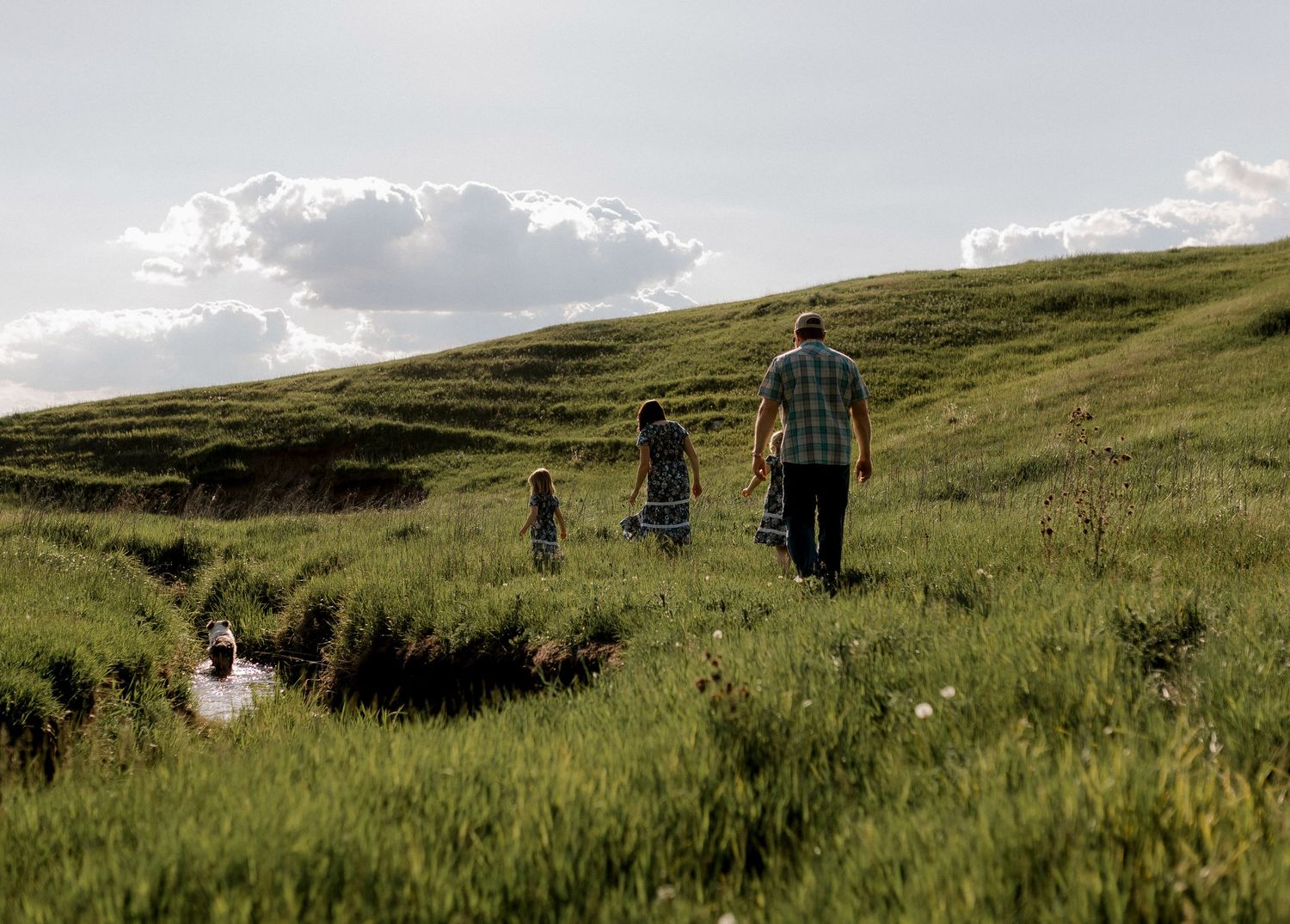 Candid family portrait with natural light and movement