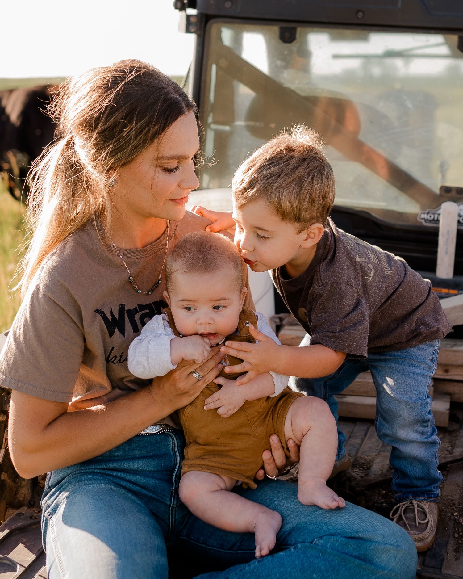 Family portrait on a working farm during lifestyle photo session in Clark County, South Dakota
