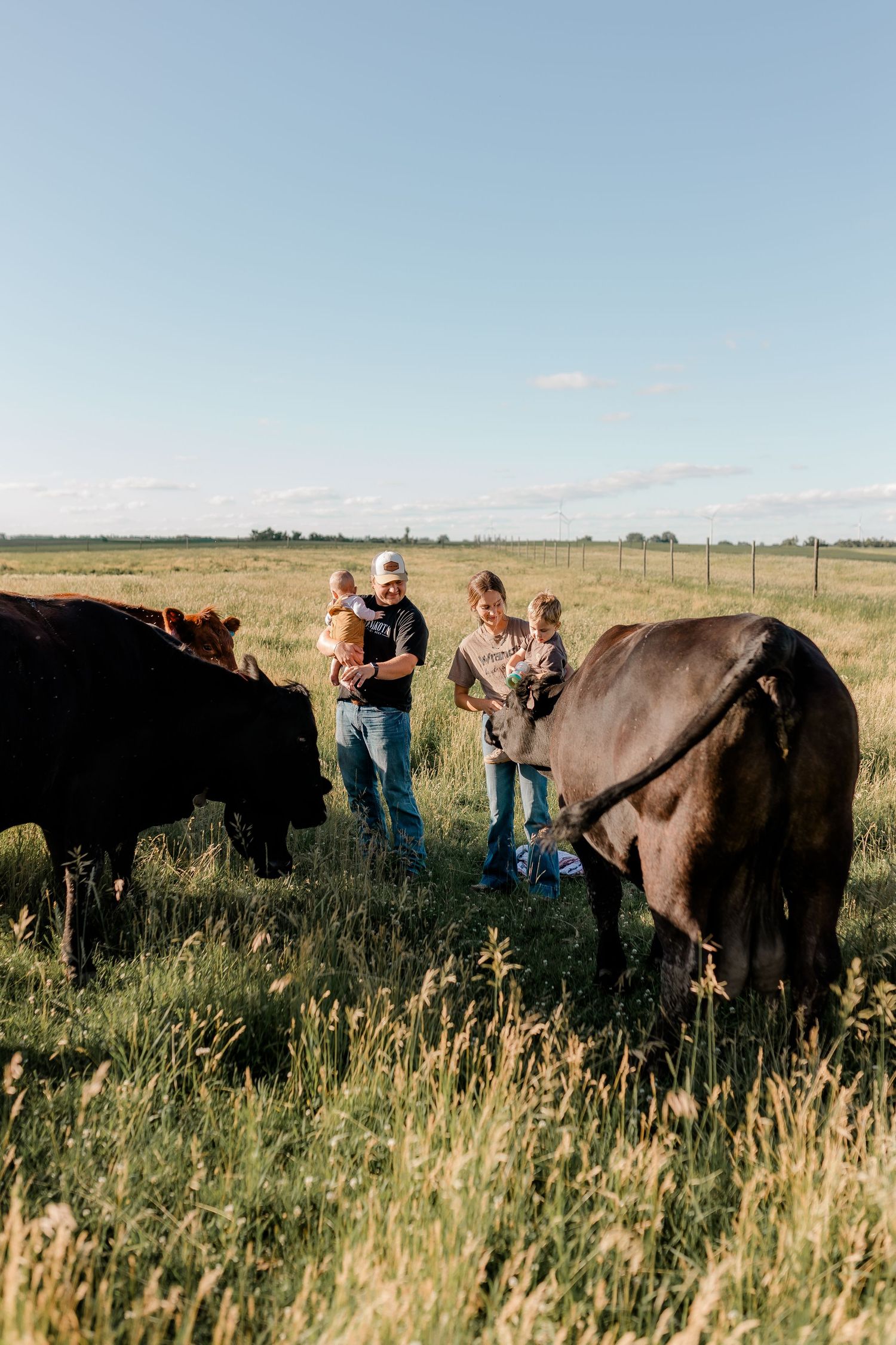 Family portrait on a working farm during lifestyle photo session in Clark County, South Dakota