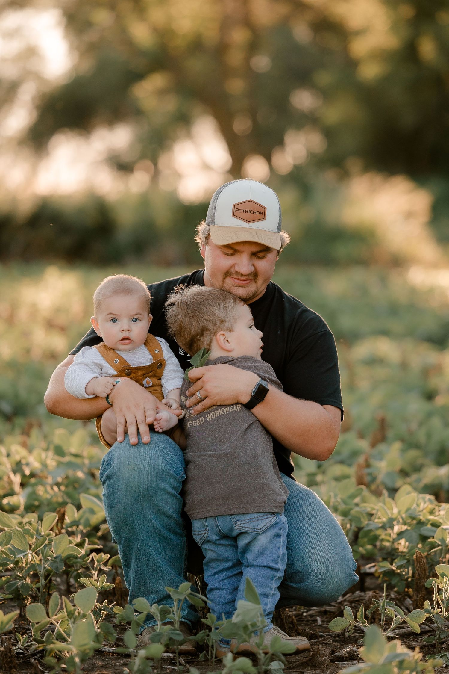 Family portrait on a working farm during lifestyle photo session in Clark County, South Dakota