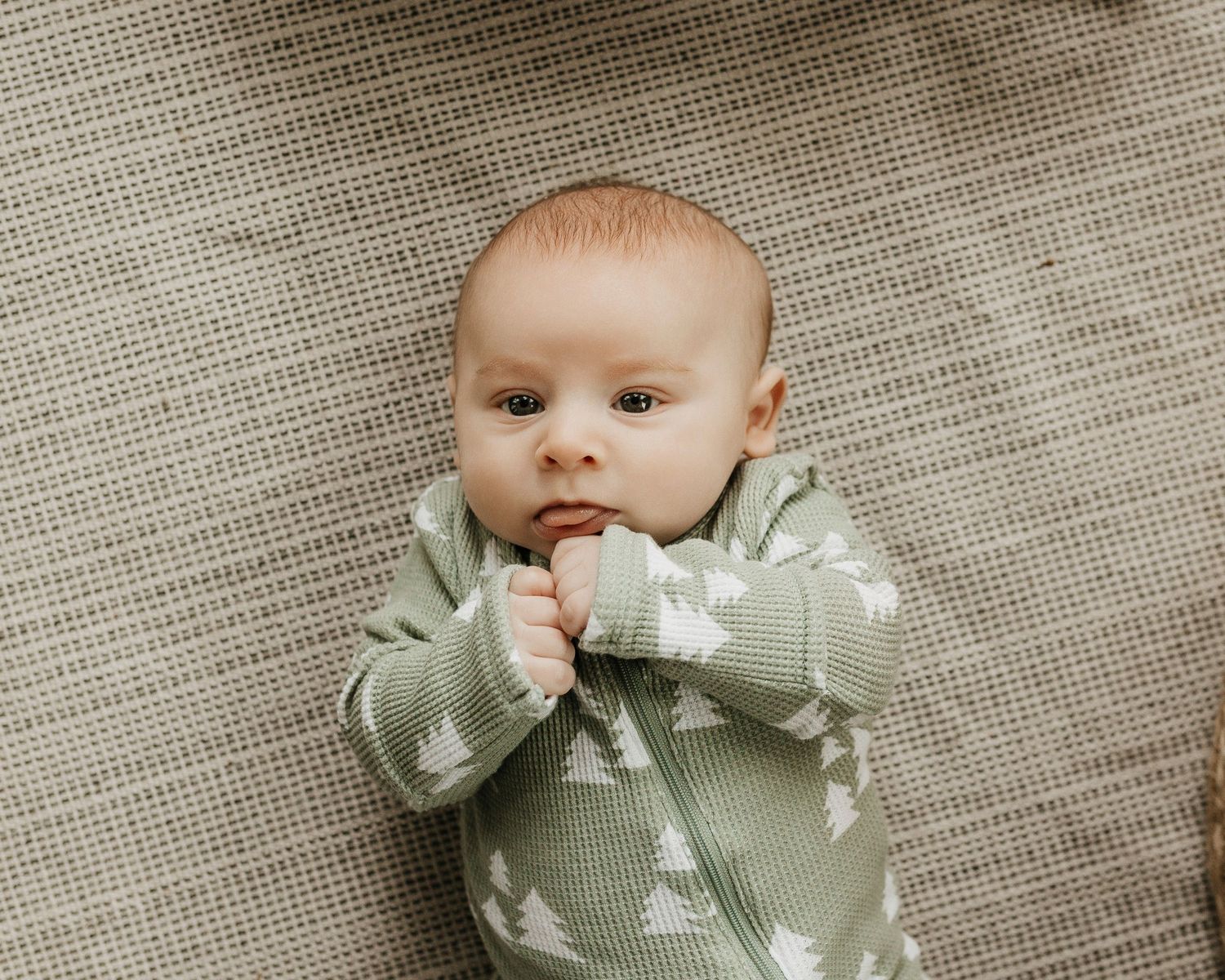 baby photo of a little  boy in a christmas outfit