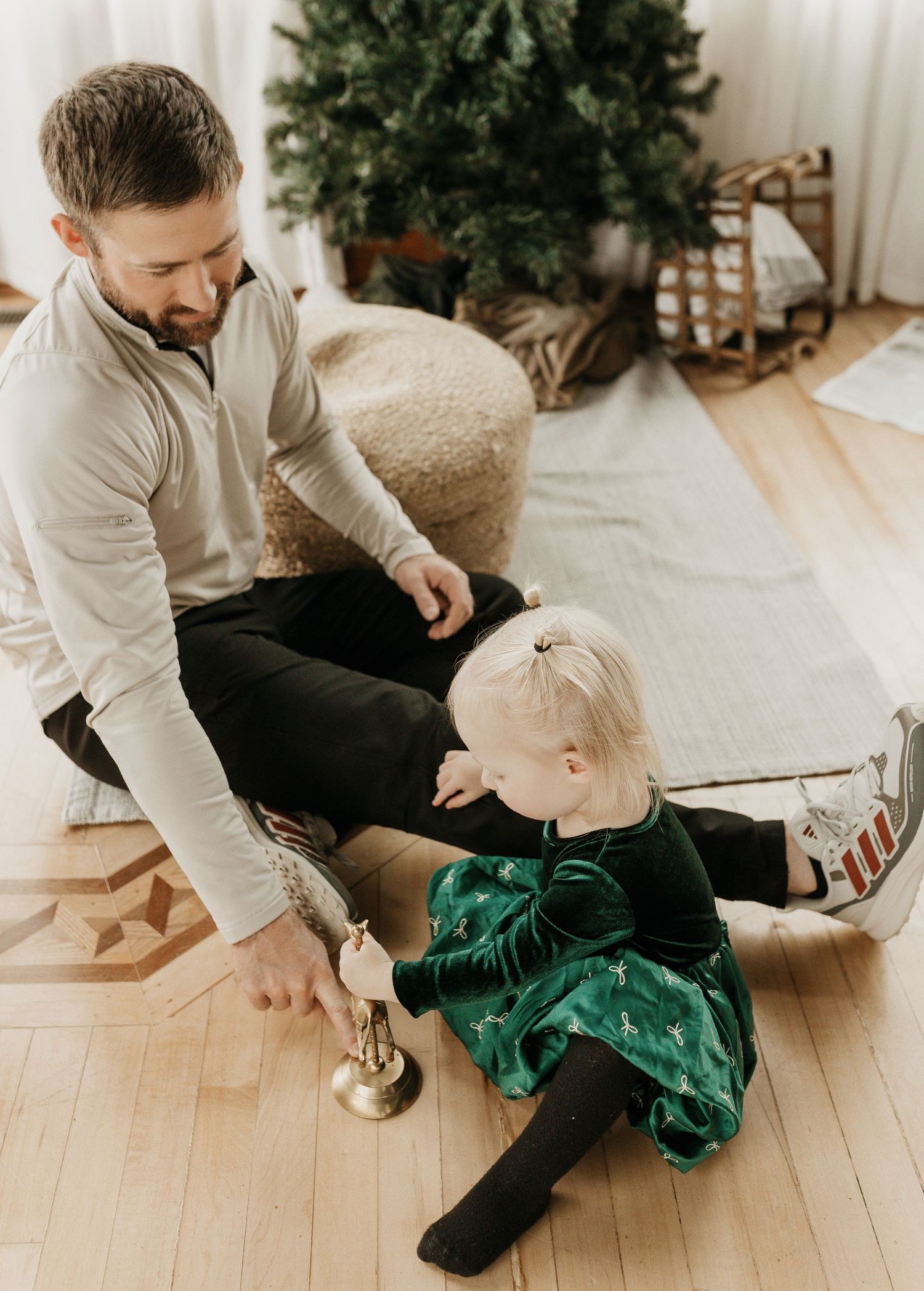 christmas photo of a dad and his toddler daughter exploring