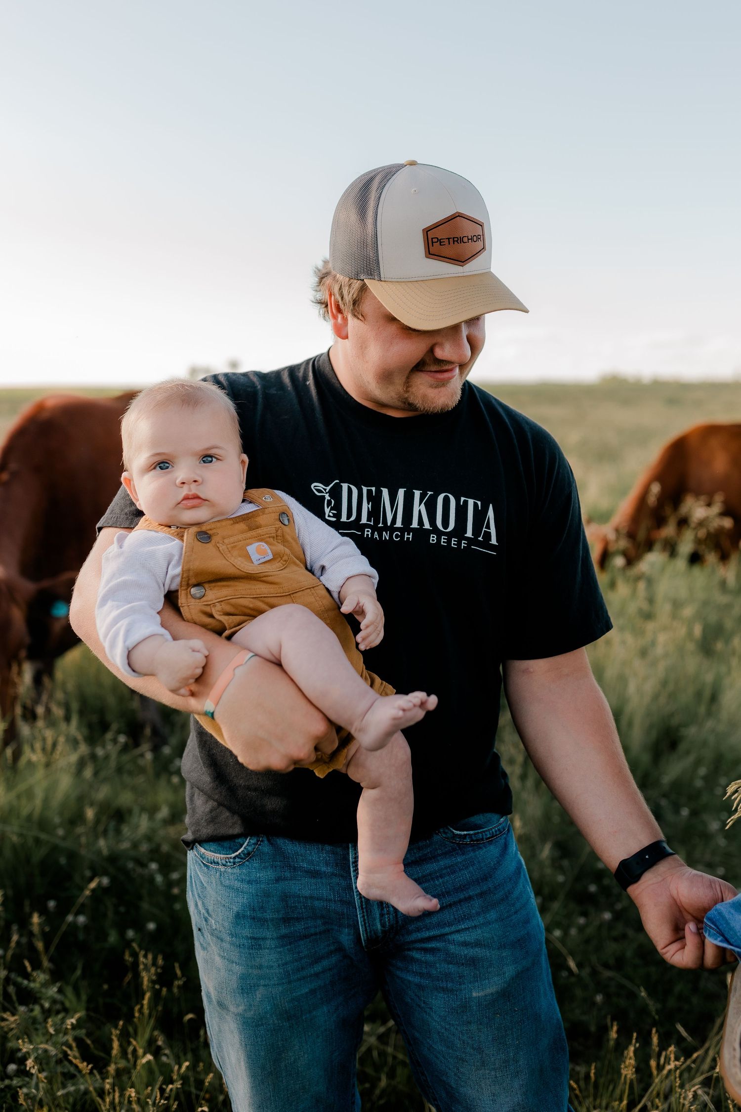 Family portrait on a working farm during lifestyle photo session in Clark County, South Dakota