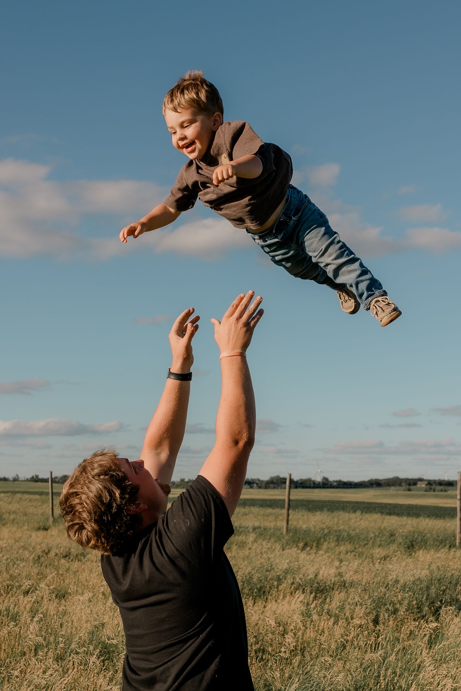 Family portrait on a working farm during lifestyle photo session in Clark County, South Dakota