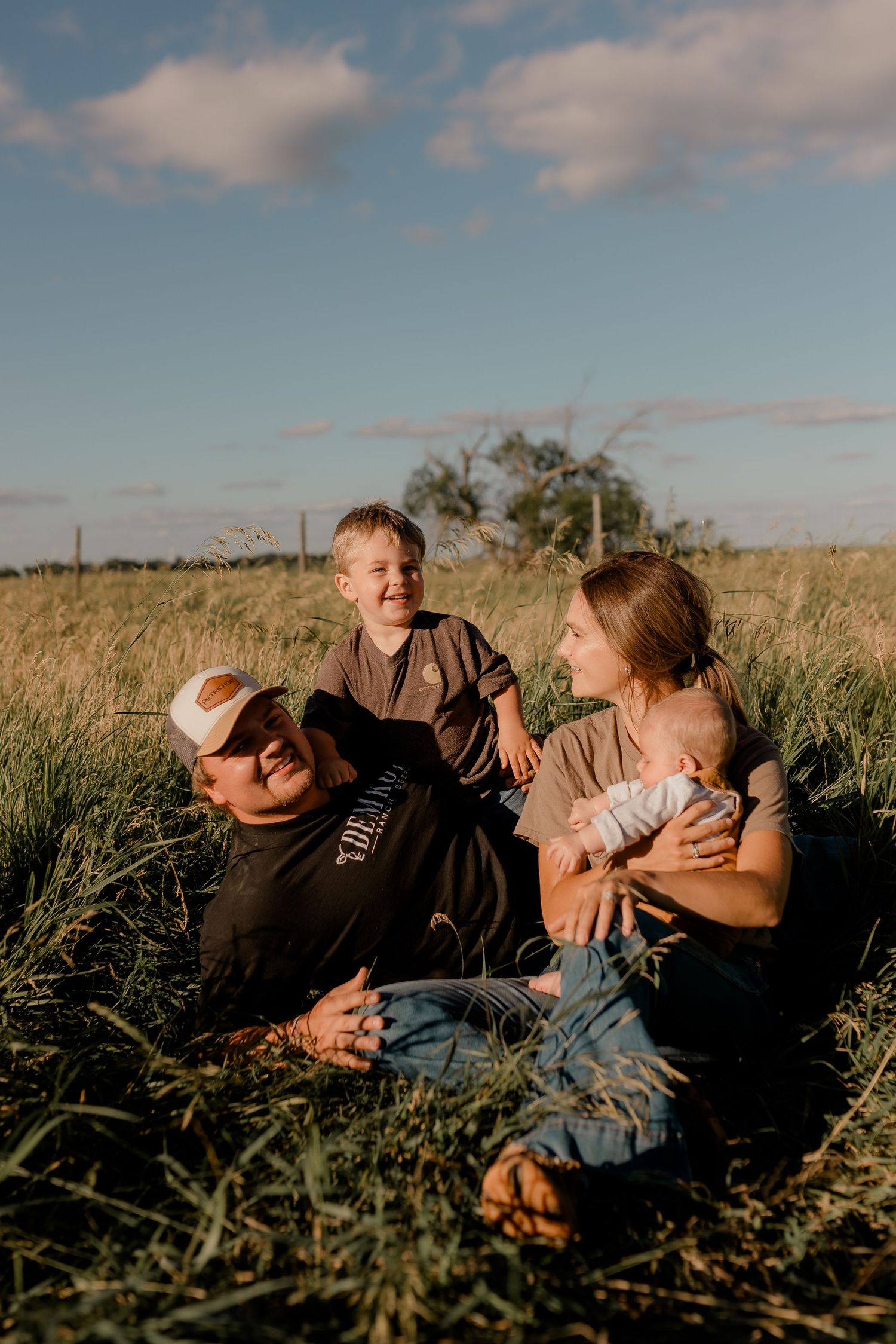 Family portrait on a working farm during lifestyle photo session in Clark County, South Dakota