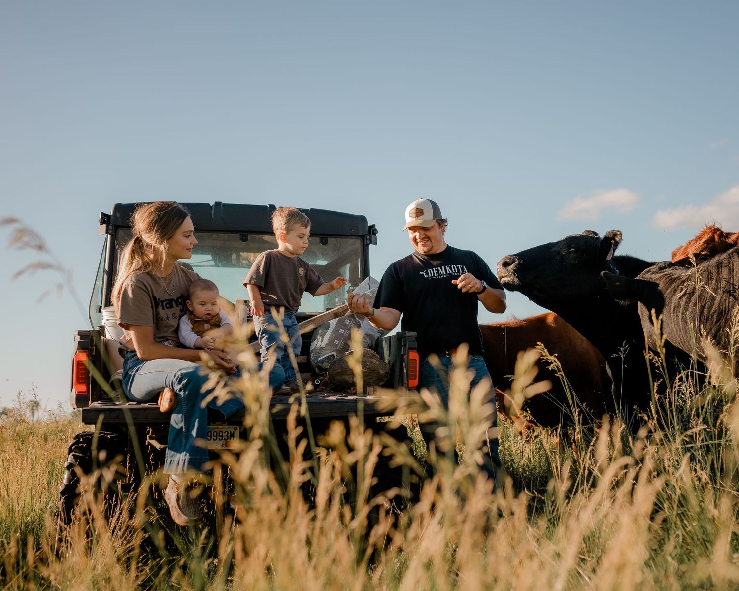 Family portrait on a working farm during lifestyle photo session in Clark County, South Dakota