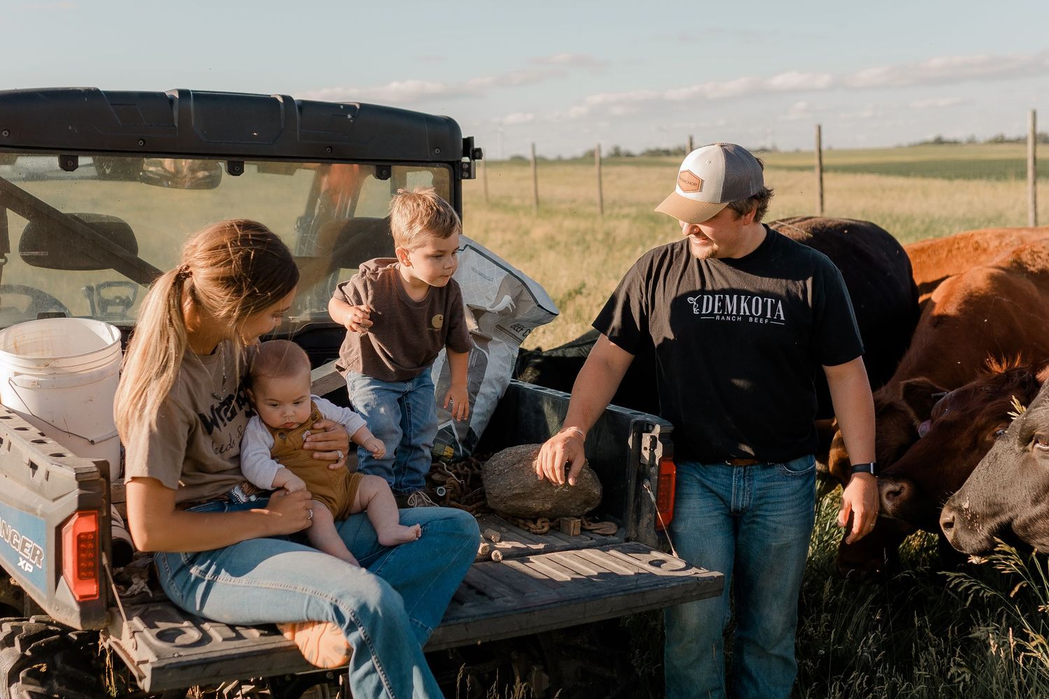 Family portrait on a working farm during lifestyle photo session in Clark County, South Dakota