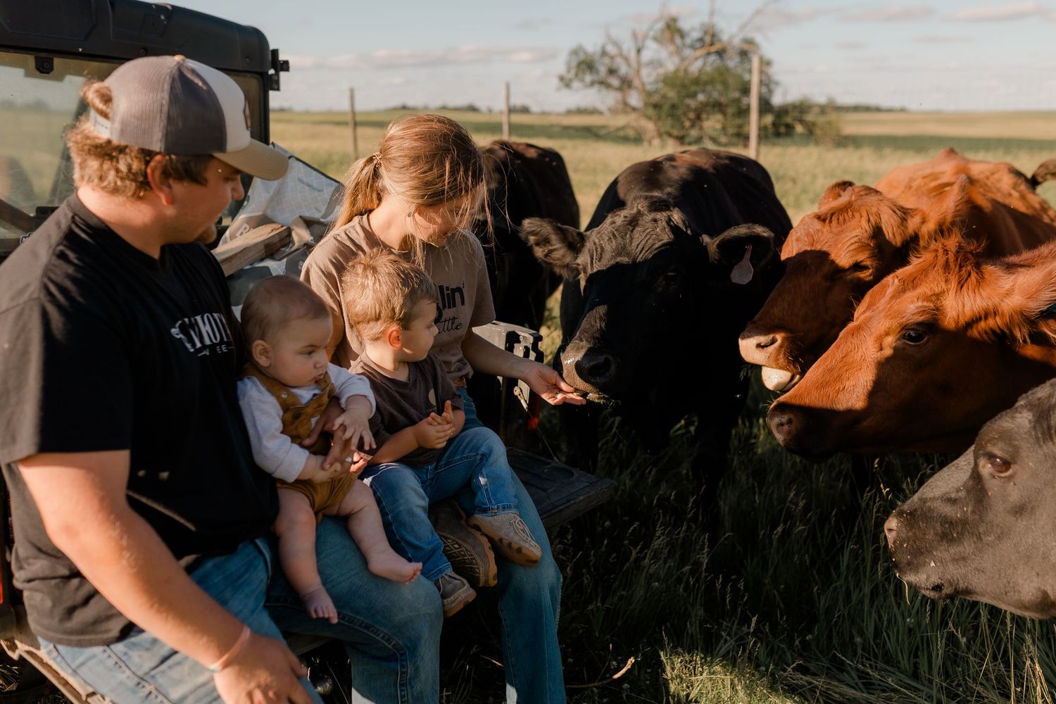 Family portrait on a working farm during lifestyle photo session in Clark County, South Dakota