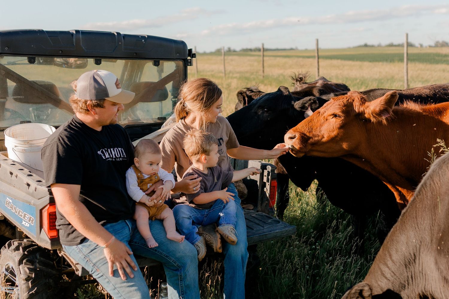 Family portrait on a working farm during lifestyle photo session in Clark County, South Dakota