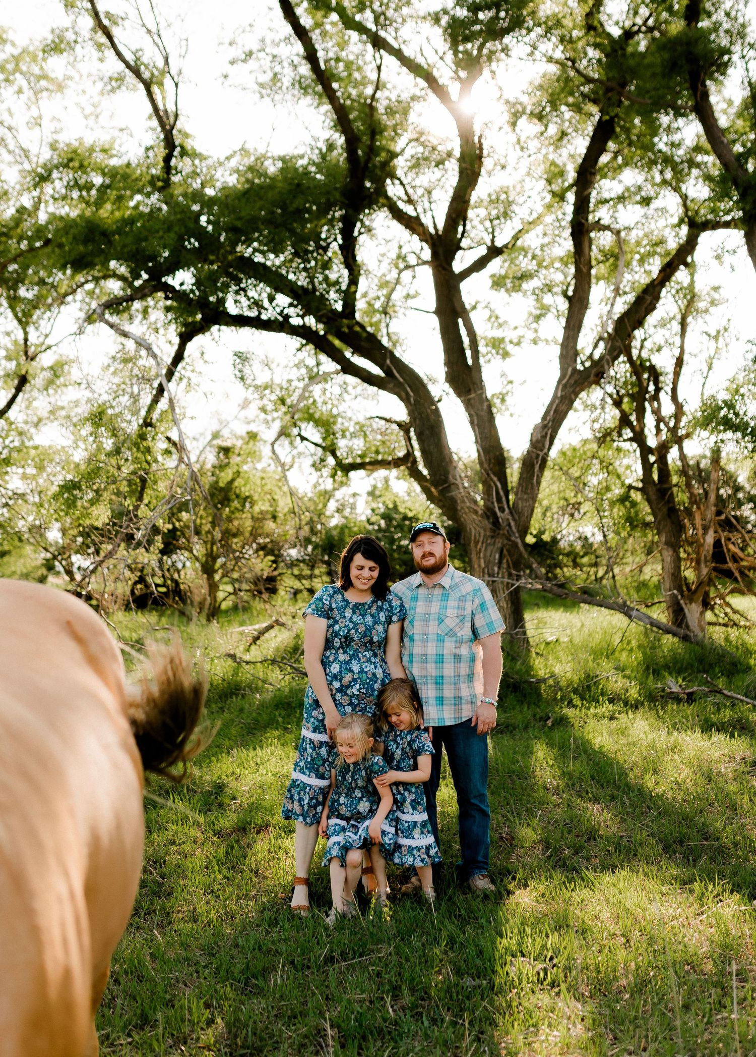 Candid family portrait with natural light and movement