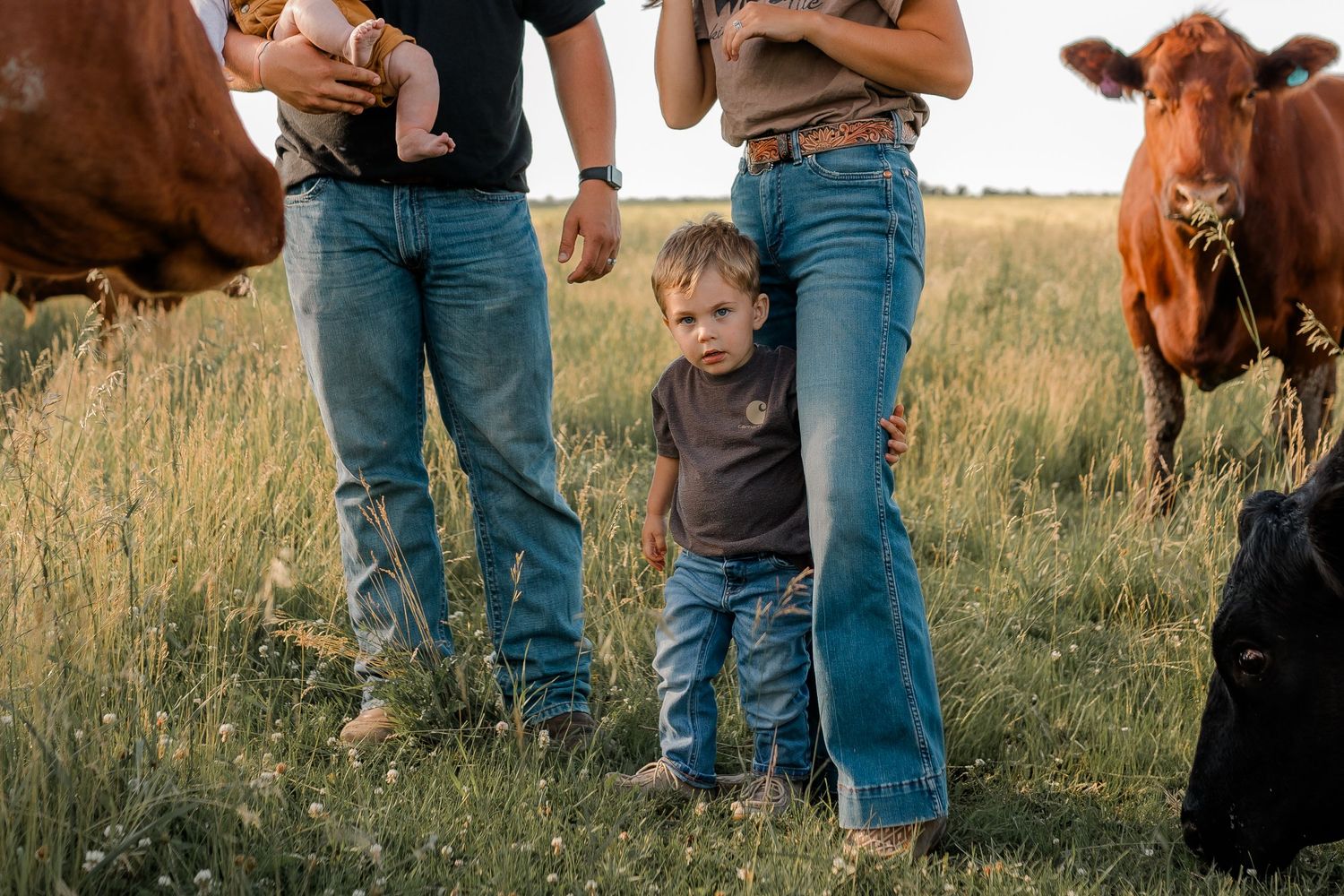 Family portrait on a working farm during lifestyle photo session in Clark County, South Dakota