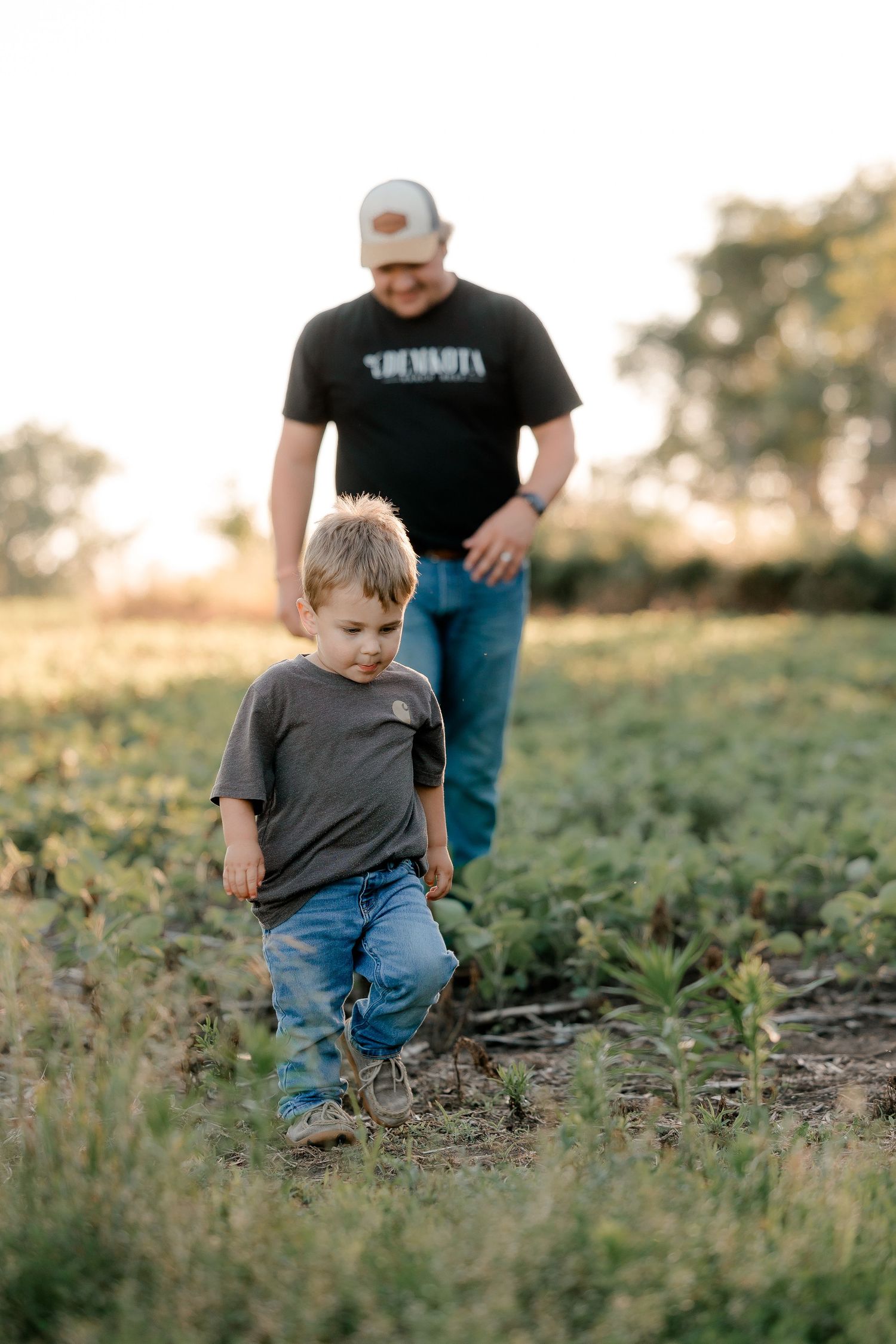 Family portrait on a working farm during lifestyle photo session in Clark County, South Dakota