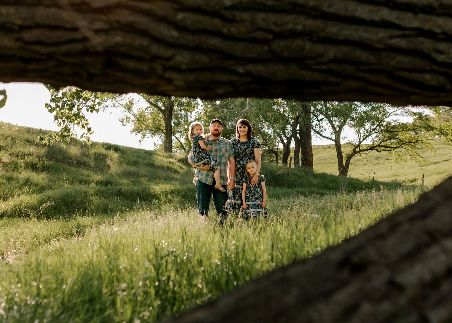 Candid family portrait with natural light and movement