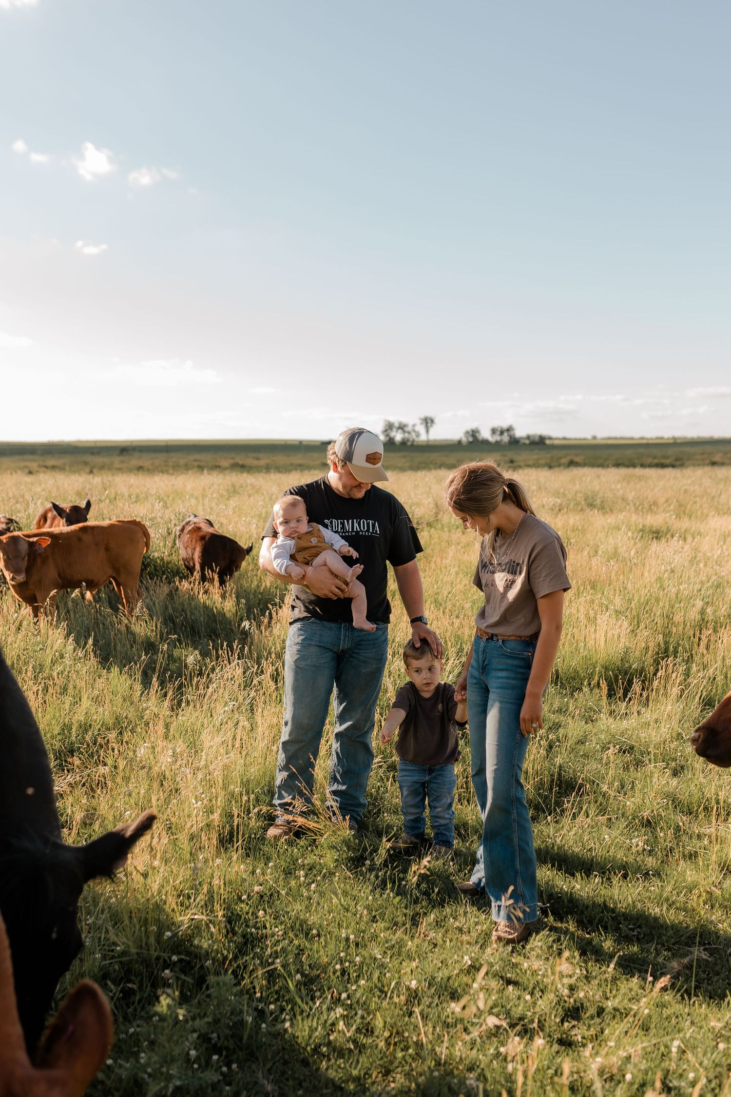 Family portrait on a working farm during lifestyle photo session in Clark County, South Dakota