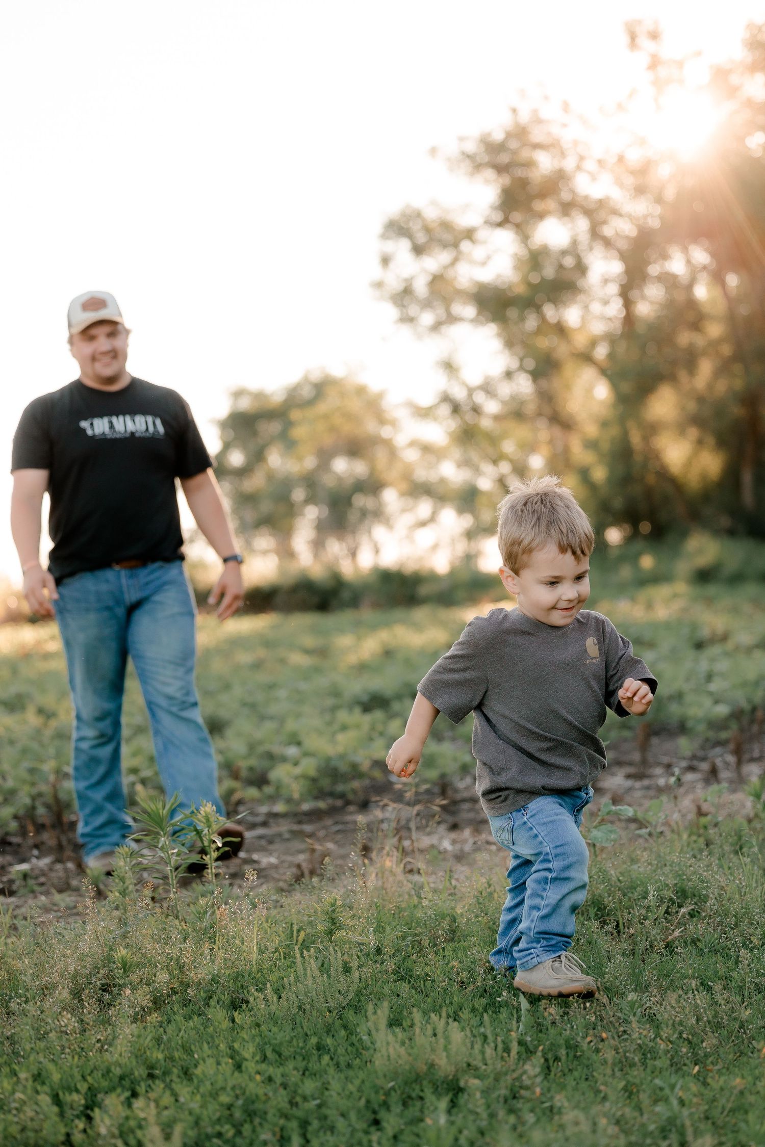 Family portrait on a working farm during lifestyle photo session in Clark County, South Dakota
