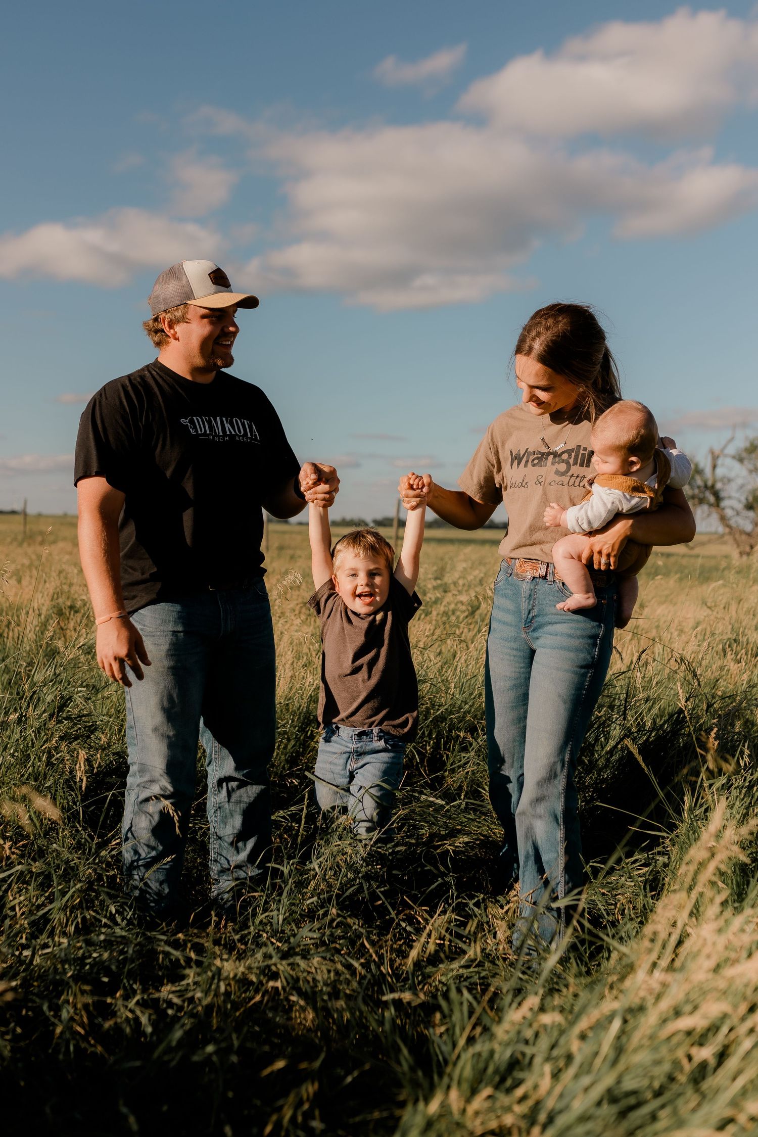 Family portrait on a working farm during lifestyle photo session in Clark County, South Dakota