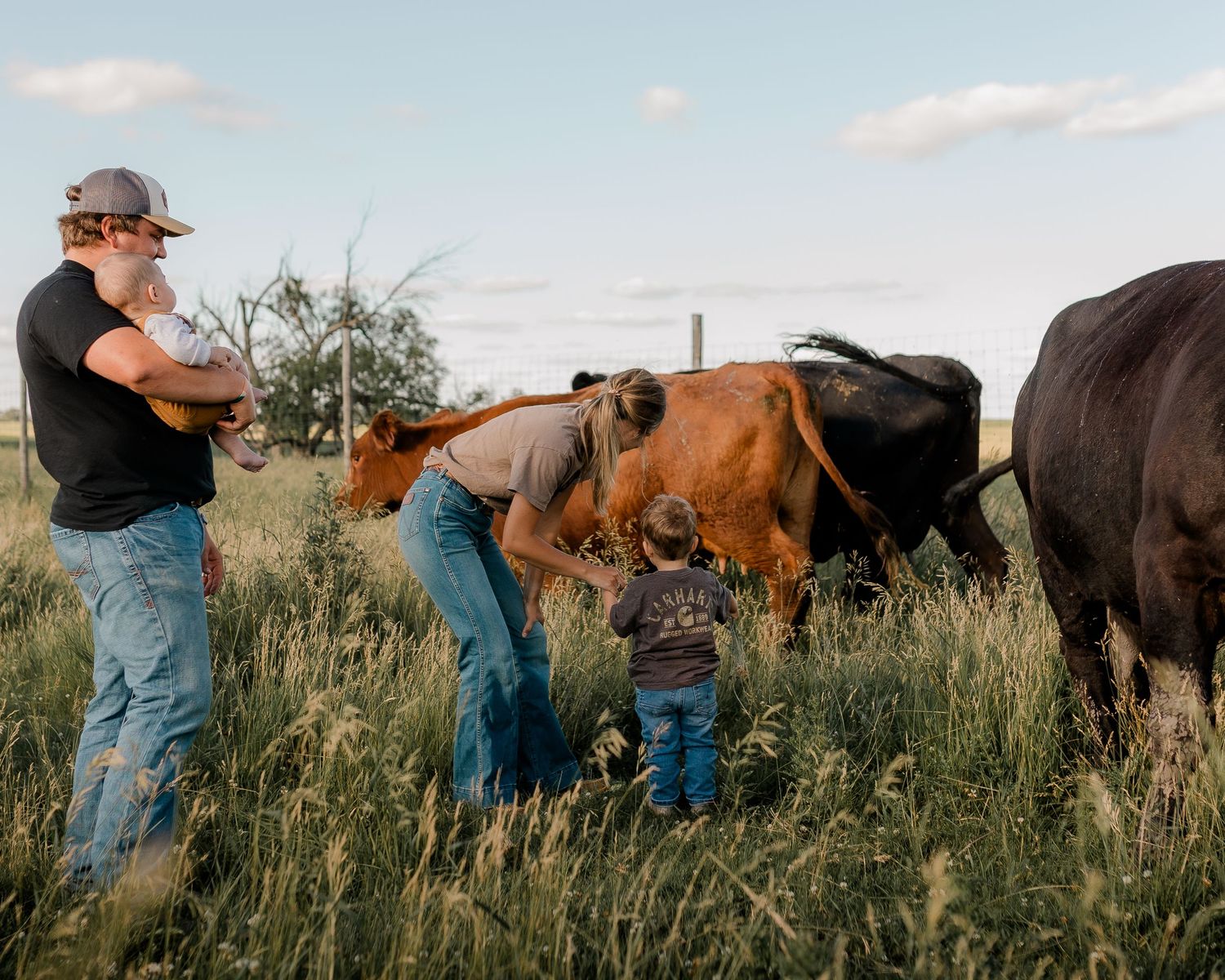 Family portrait on a working farm during lifestyle photo session in Clark County, South Dakota
