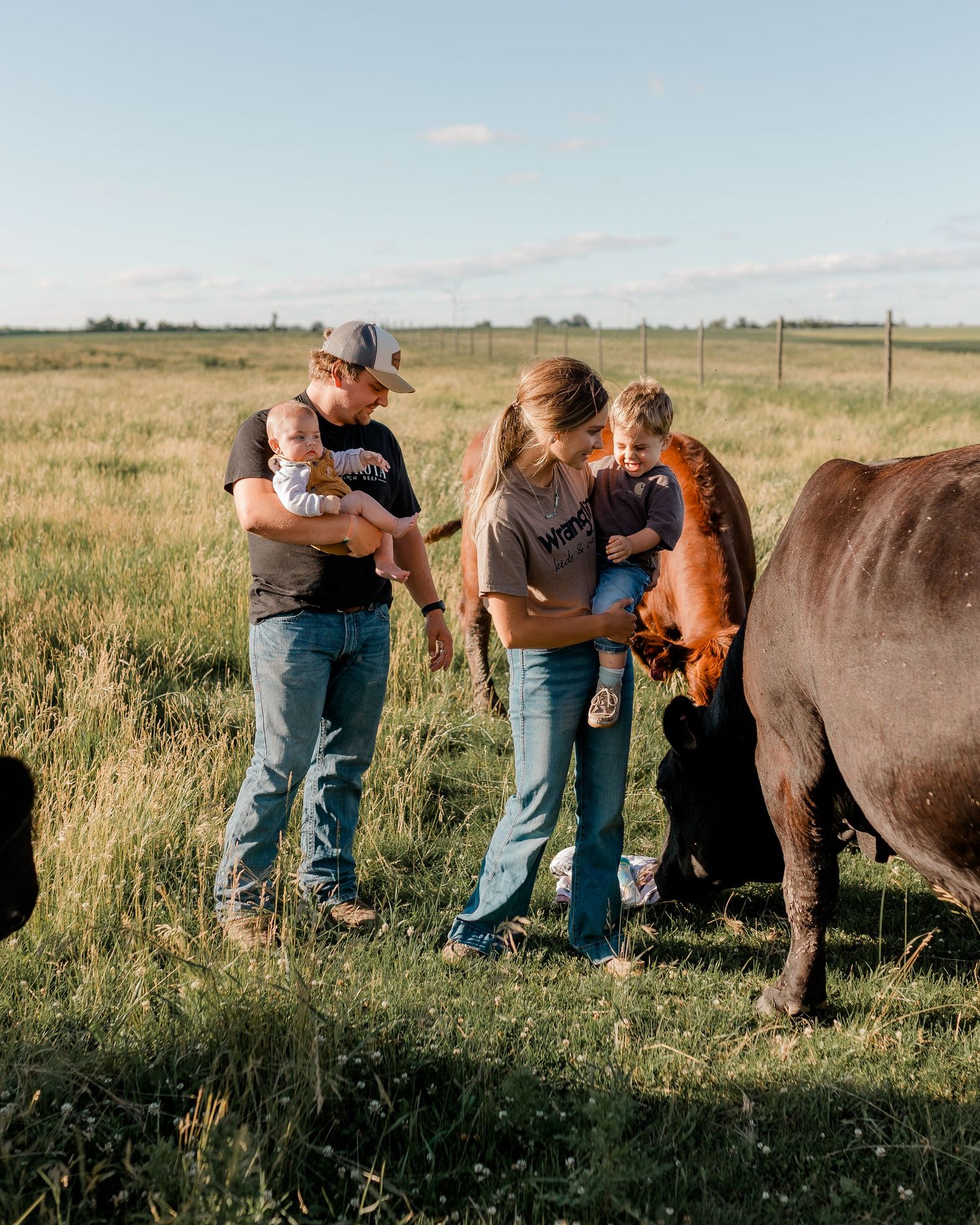Family portrait on a working farm during lifestyle photo session in Clark County, South Dakota