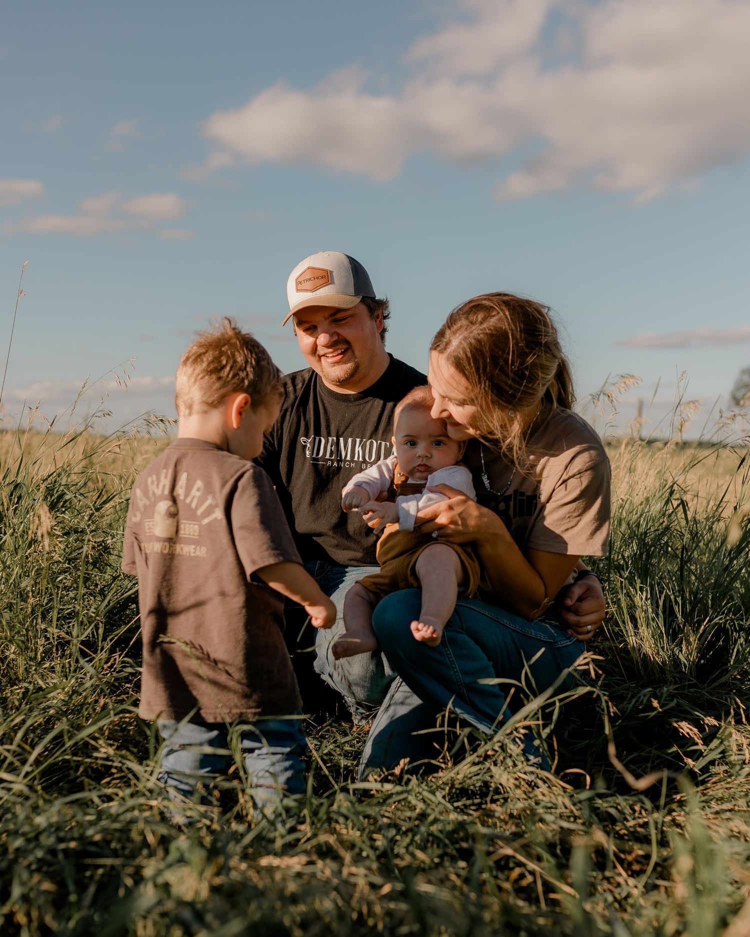 Family portrait on a working farm during lifestyle photo session in Clark County, South Dakota