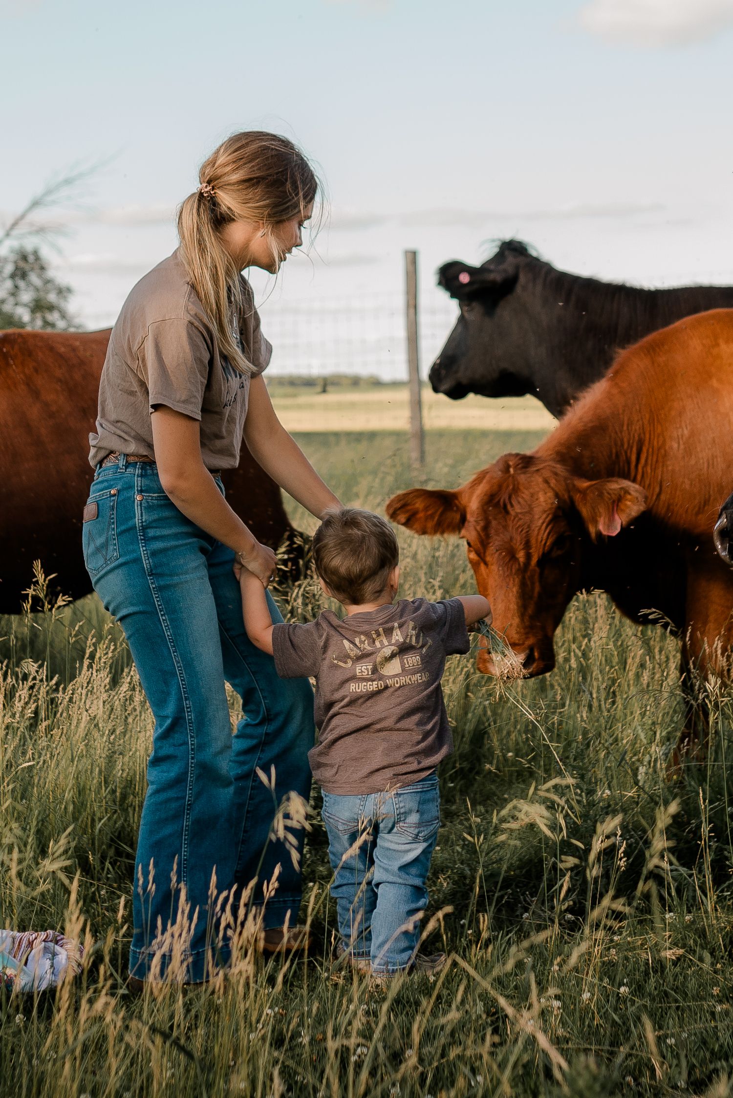 Family portrait on a working farm during lifestyle photo session in Clark County, South Dakota