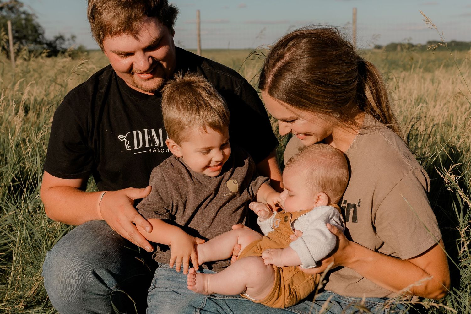 Family portrait on a working farm during lifestyle photo session in Clark County, South Dakota