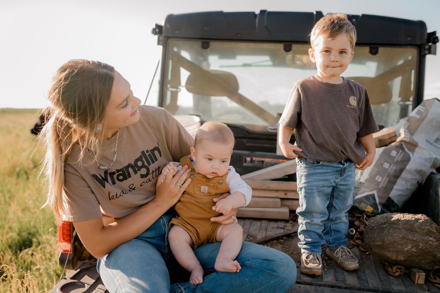 Family portrait on a working farm during lifestyle photo session in Clark County, South Dakota